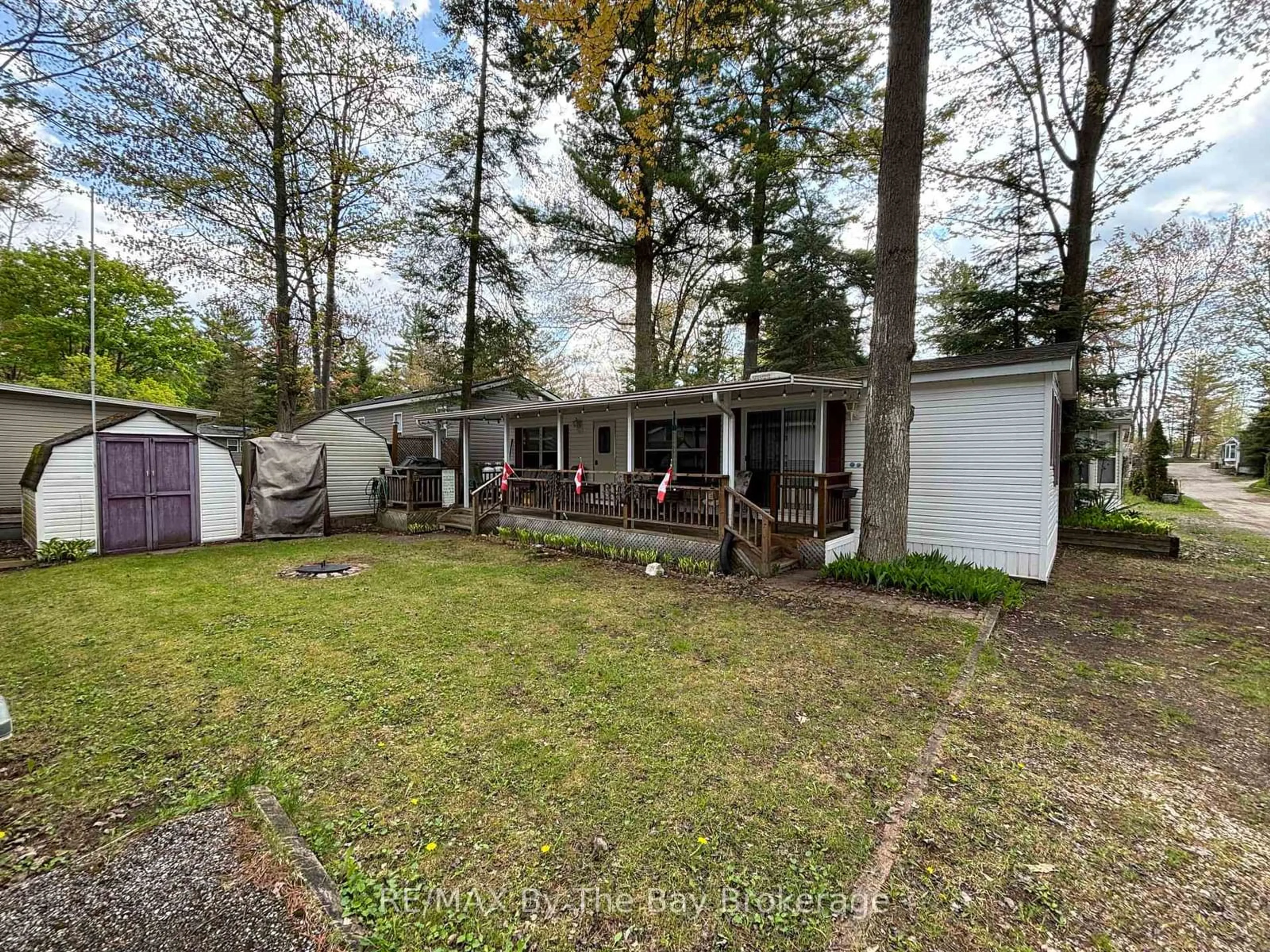 A pic from outside/outdoor area/front of a property/back of a property/a pic from drone, unknown for 85 Theme Park Dr #153, Wasaga Beach Ontario L9Z 1X7