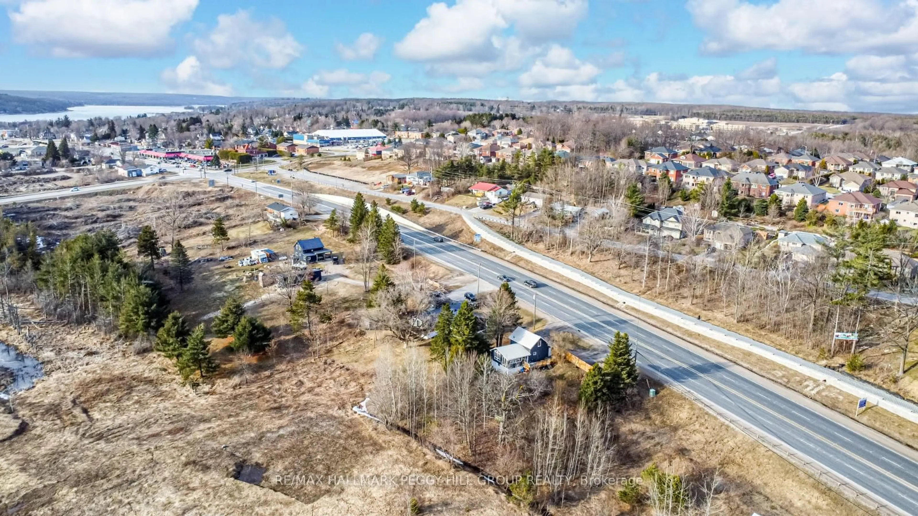 A pic from outside/outdoor area/front of a property/back of a property/a pic from drone, street for 9866 County Road 93 N/A, Midland Ontario L0K 2E1