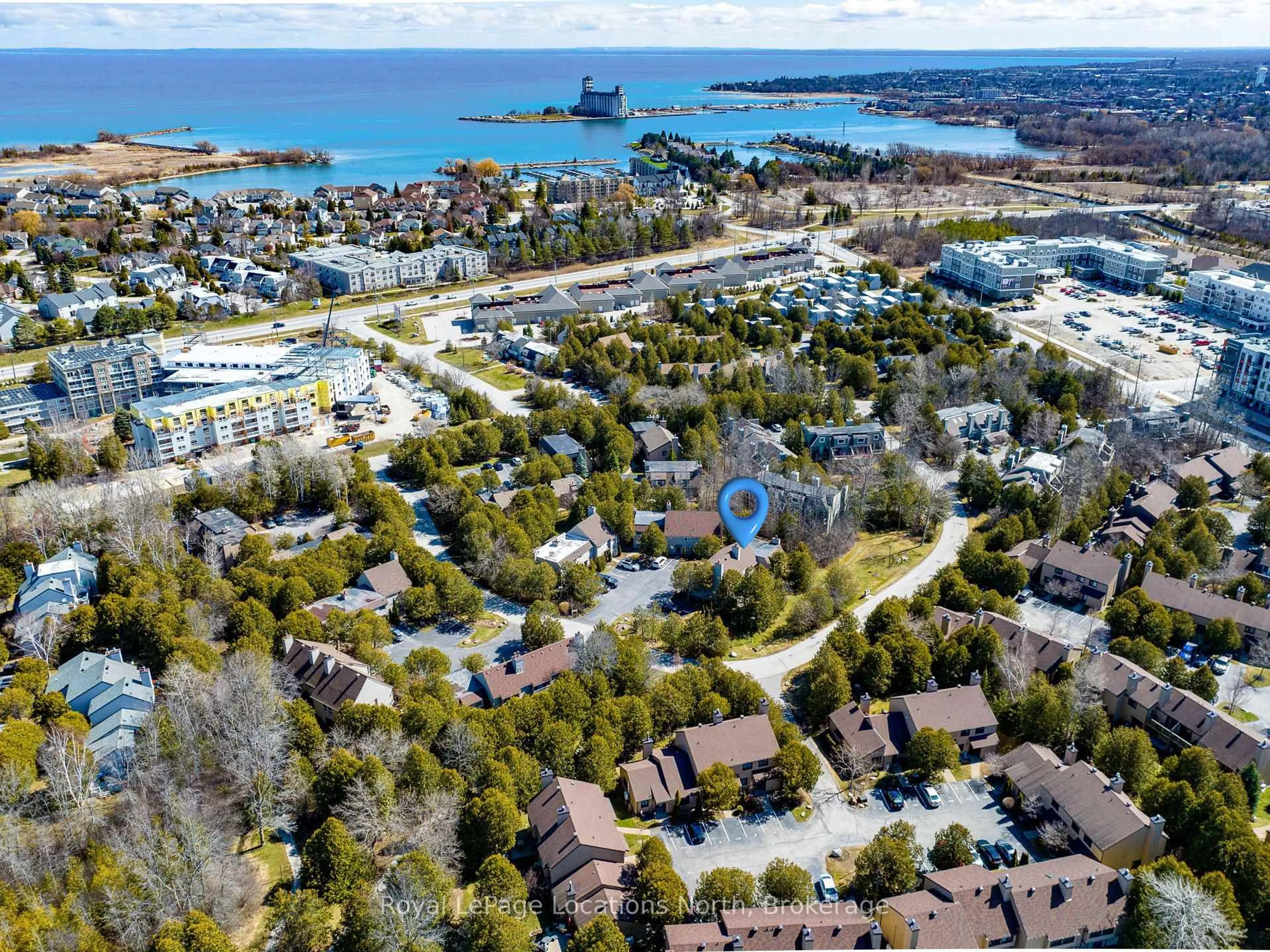 A pic from outside/outdoor area/front of a property/back of a property/a pic from drone, water/lake/river/ocean view for 138 Escarpment Cres, Collingwood Ontario L9Y 5B4