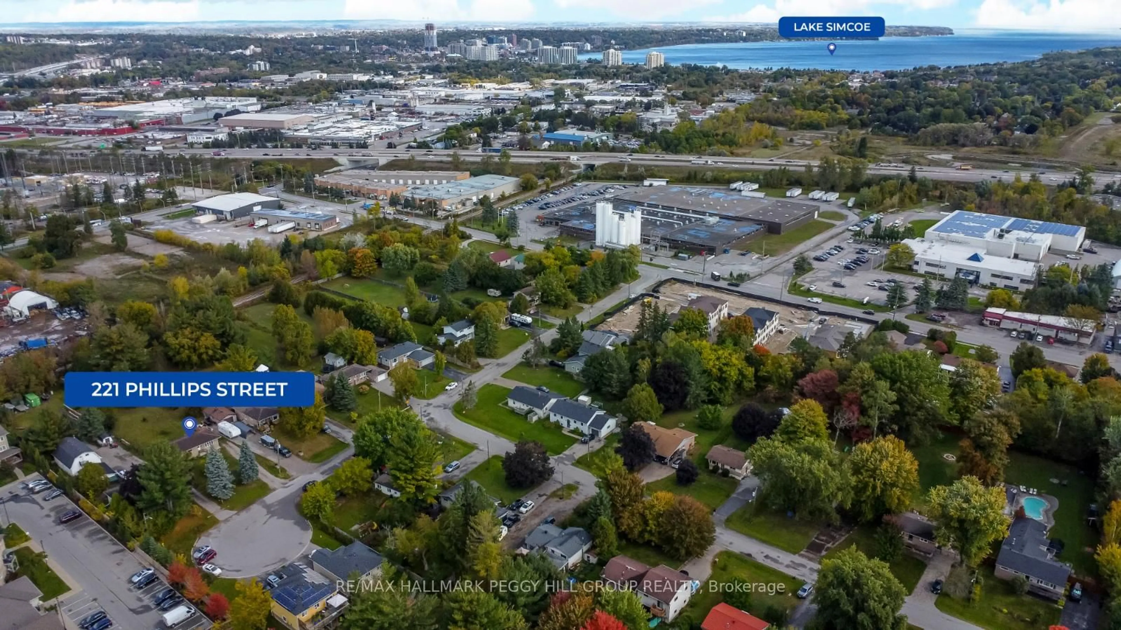 A pic from outside/outdoor area/front of a property/back of a property/a pic from drone, city buildings view from balcony for 221 Phillips St, Barrie Ontario L4N 3V2