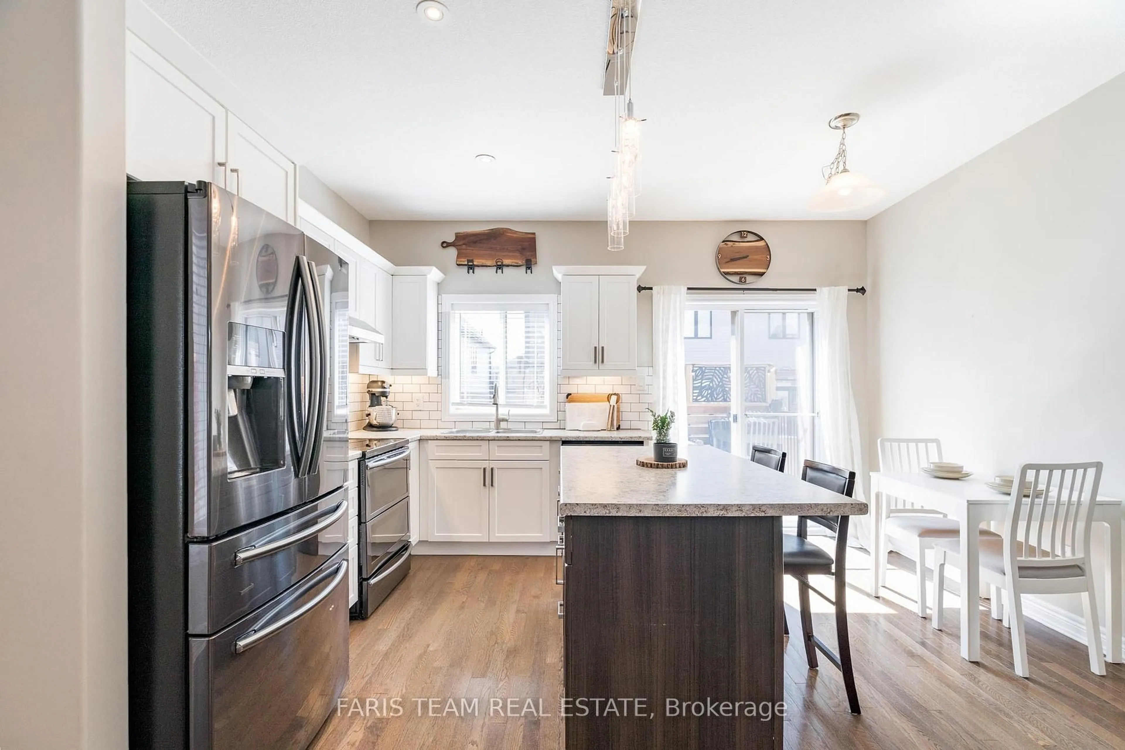 Open concept kitchen, wood/laminate floor for 1045 Cook Dr, Midland Ontario L4R 0E4