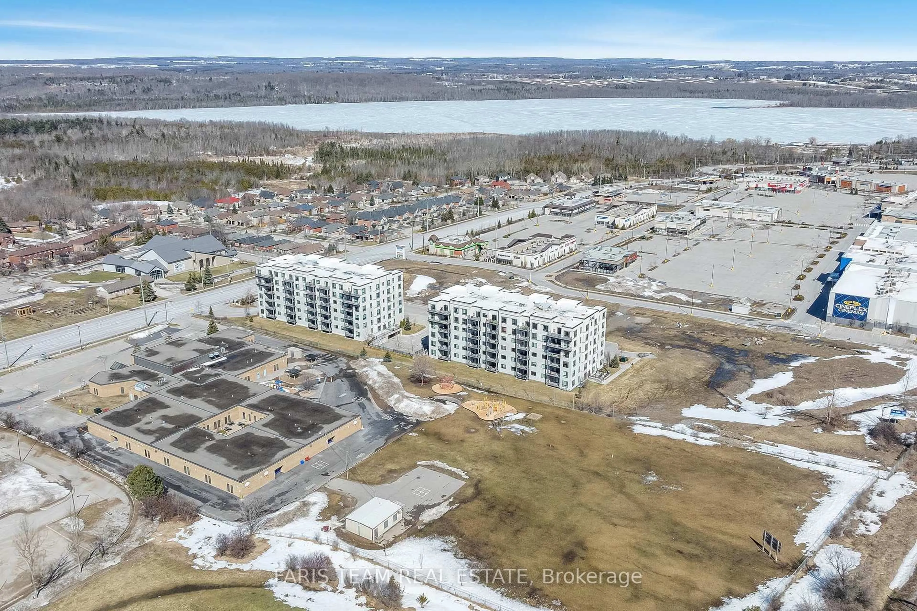 A pic from outside/outdoor area/front of a property/back of a property/a pic from drone, water/lake/river/ocean view for 299 Cundles Rd #206, Barrie Ontario L4M 0K9