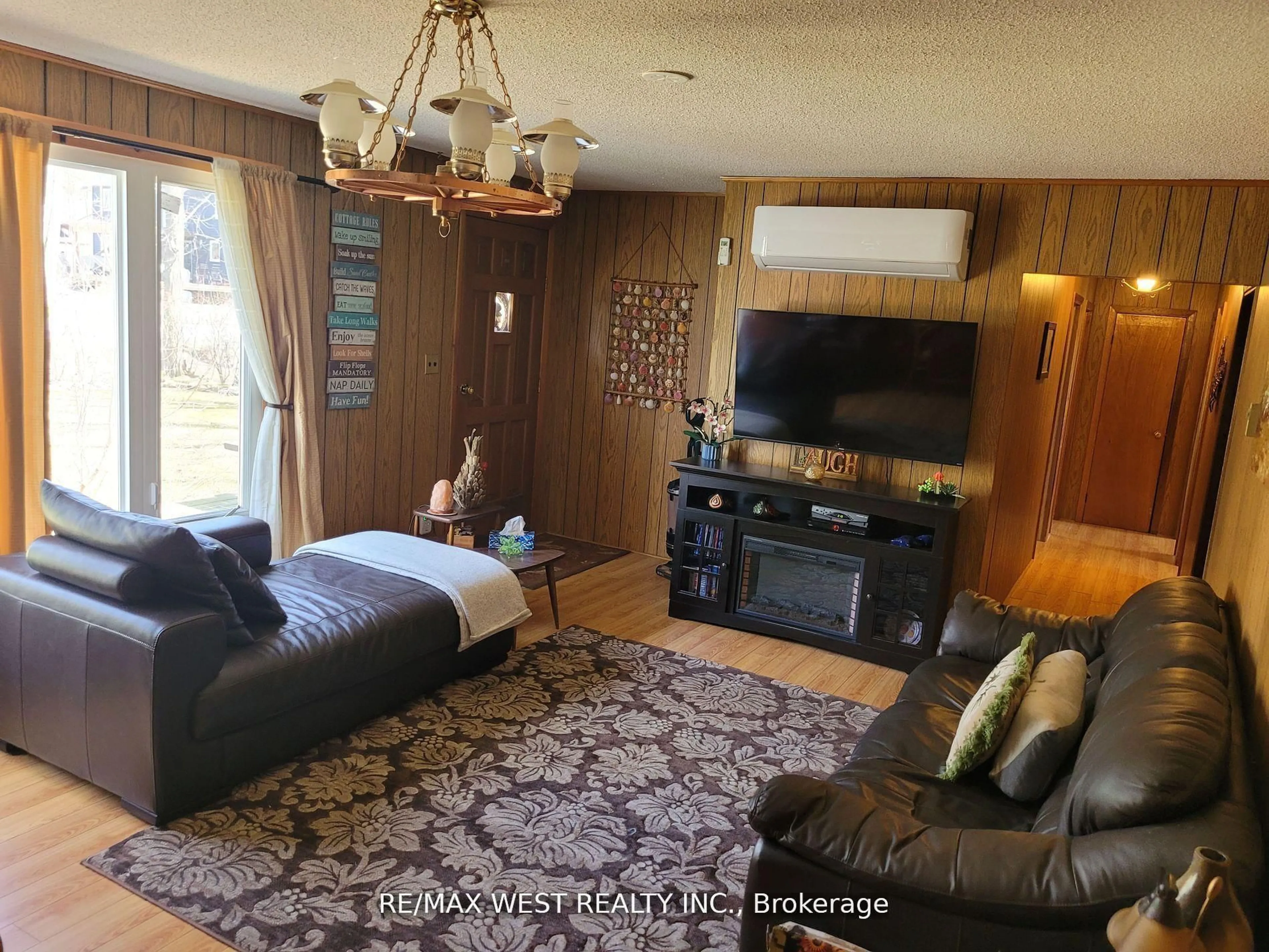 Living room with furniture, wood/laminate floor for 16 Fredrick Ave, Tiny Ontario L0L 1P0