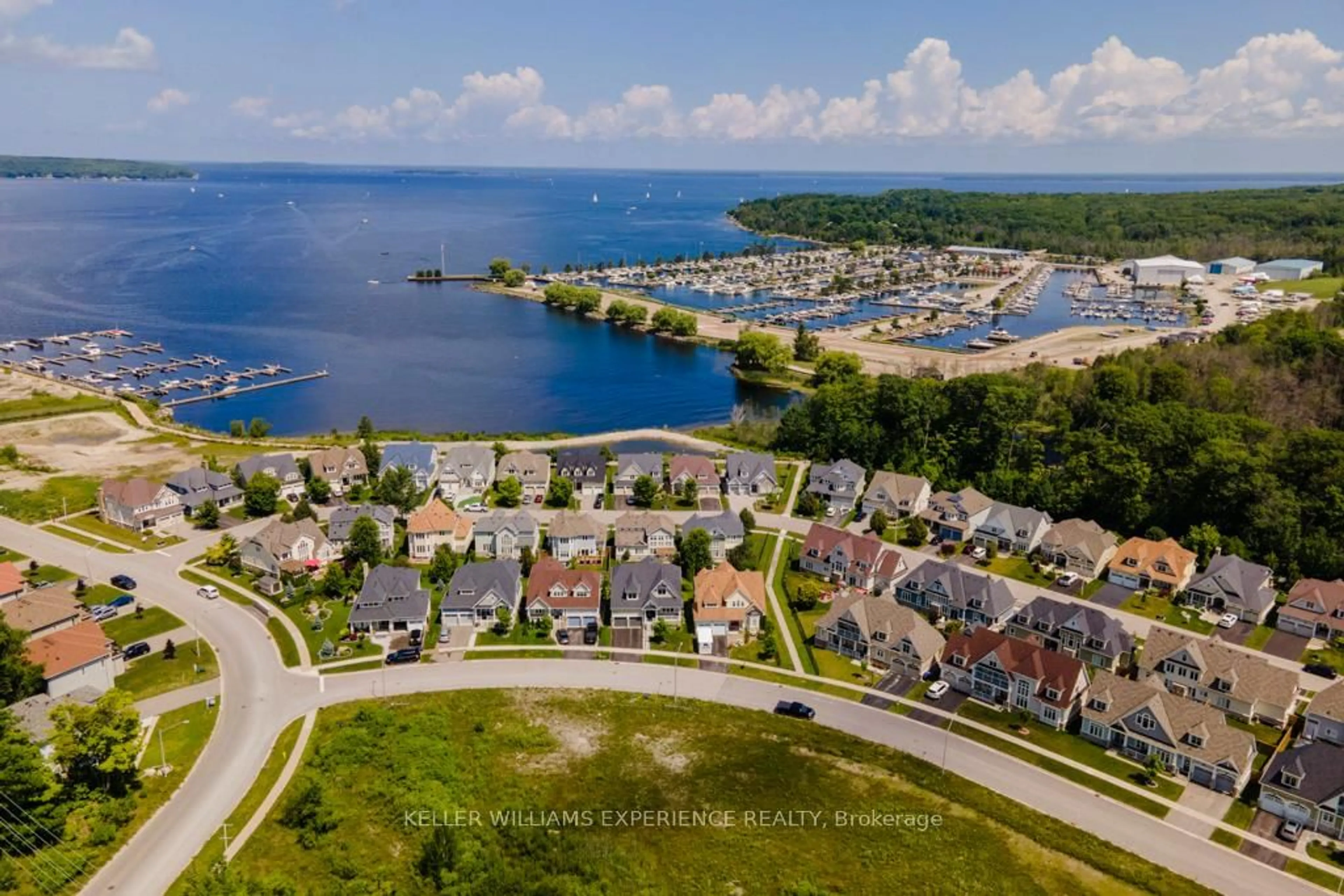 A pic from outside/outdoor area/front of a property/back of a property/a pic from drone, water/lake/river/ocean view for 101 Riverwalk Pl, Midland Ontario L4R 0B4