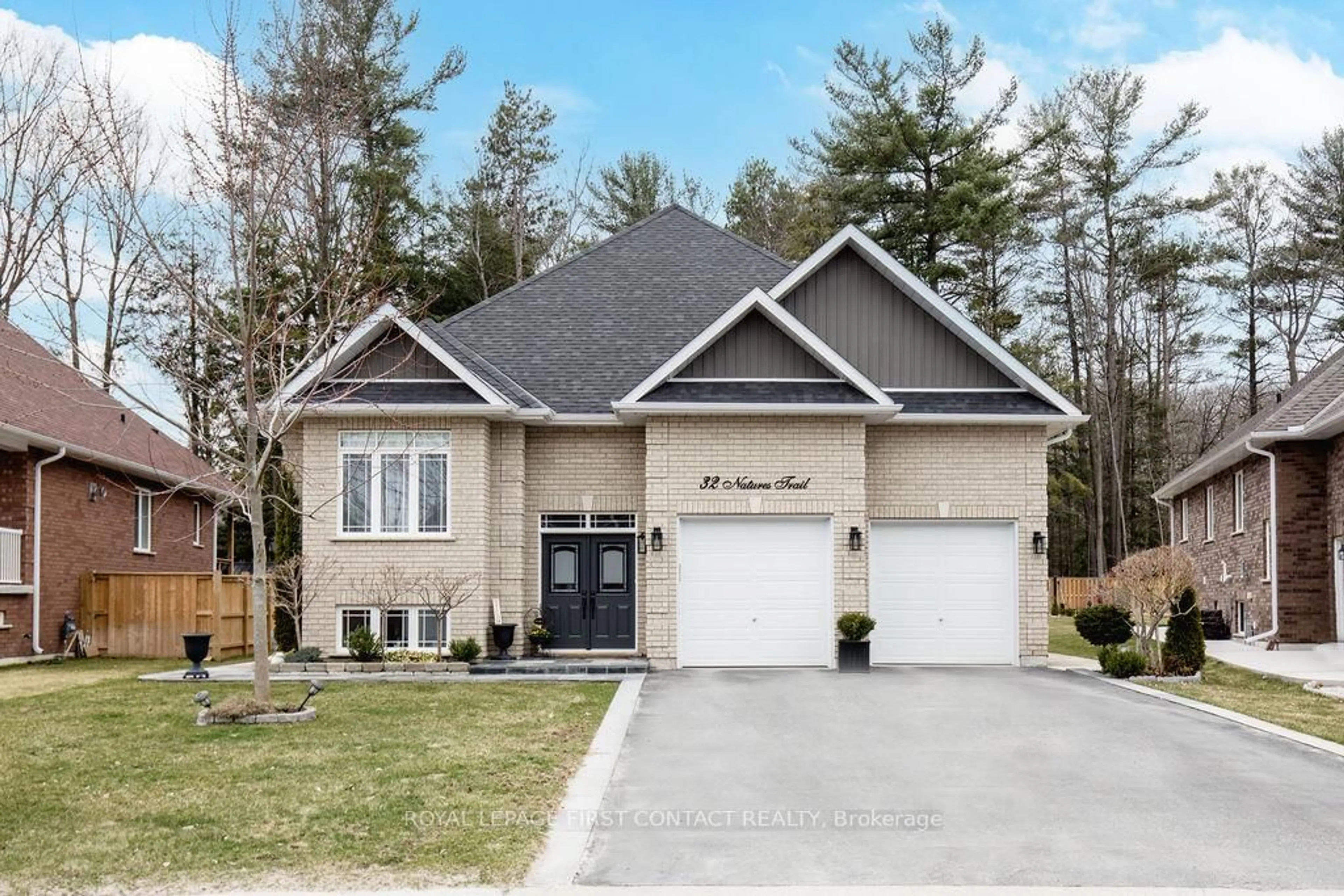 Home with brick exterior material, street for 32 Natures Tr, Wasaga Beach Ontario L9Z 0H4