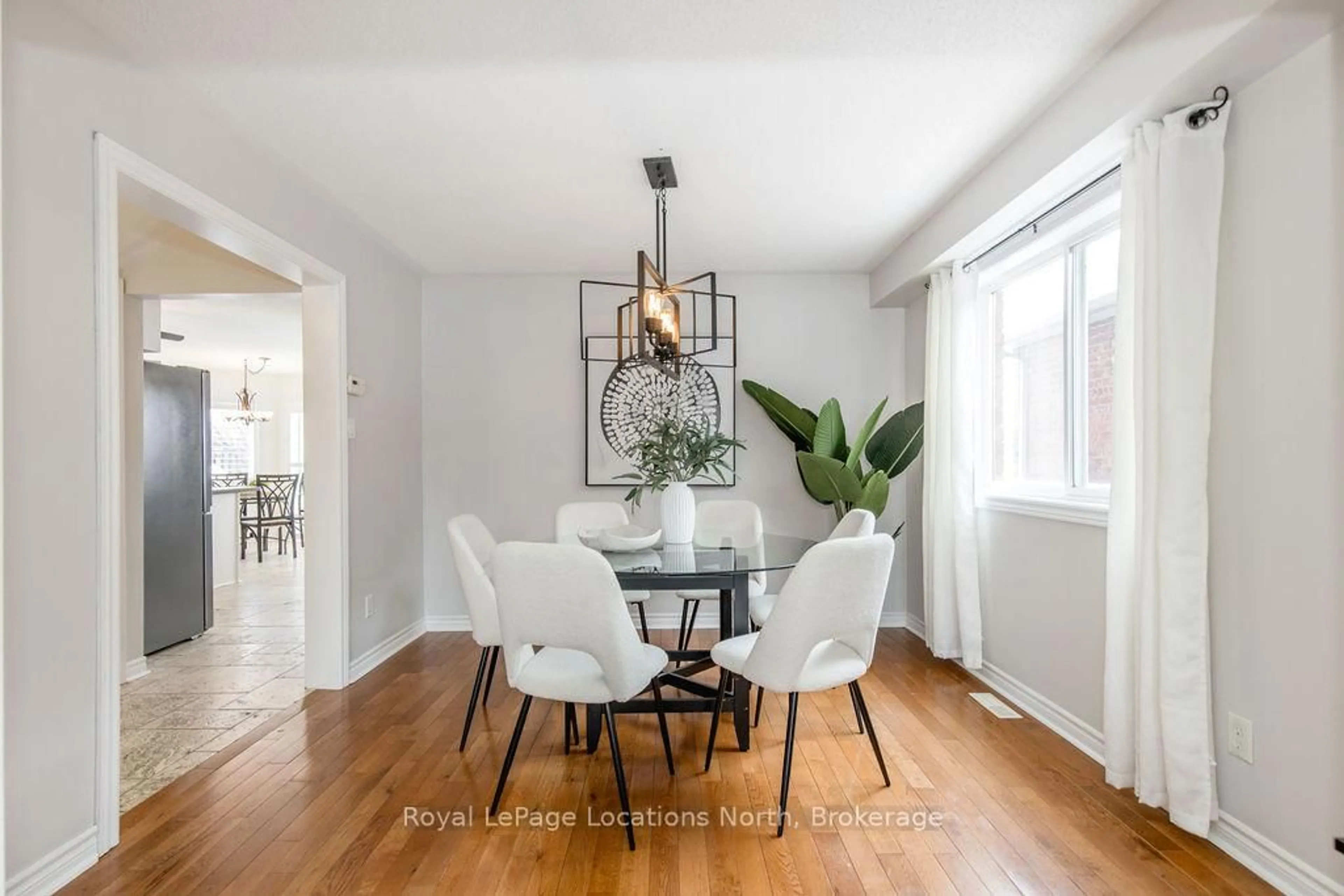 Dining room, wood/laminate floor for 45 Holly Meadow Rd, Barrie Ontario L4N 0E2