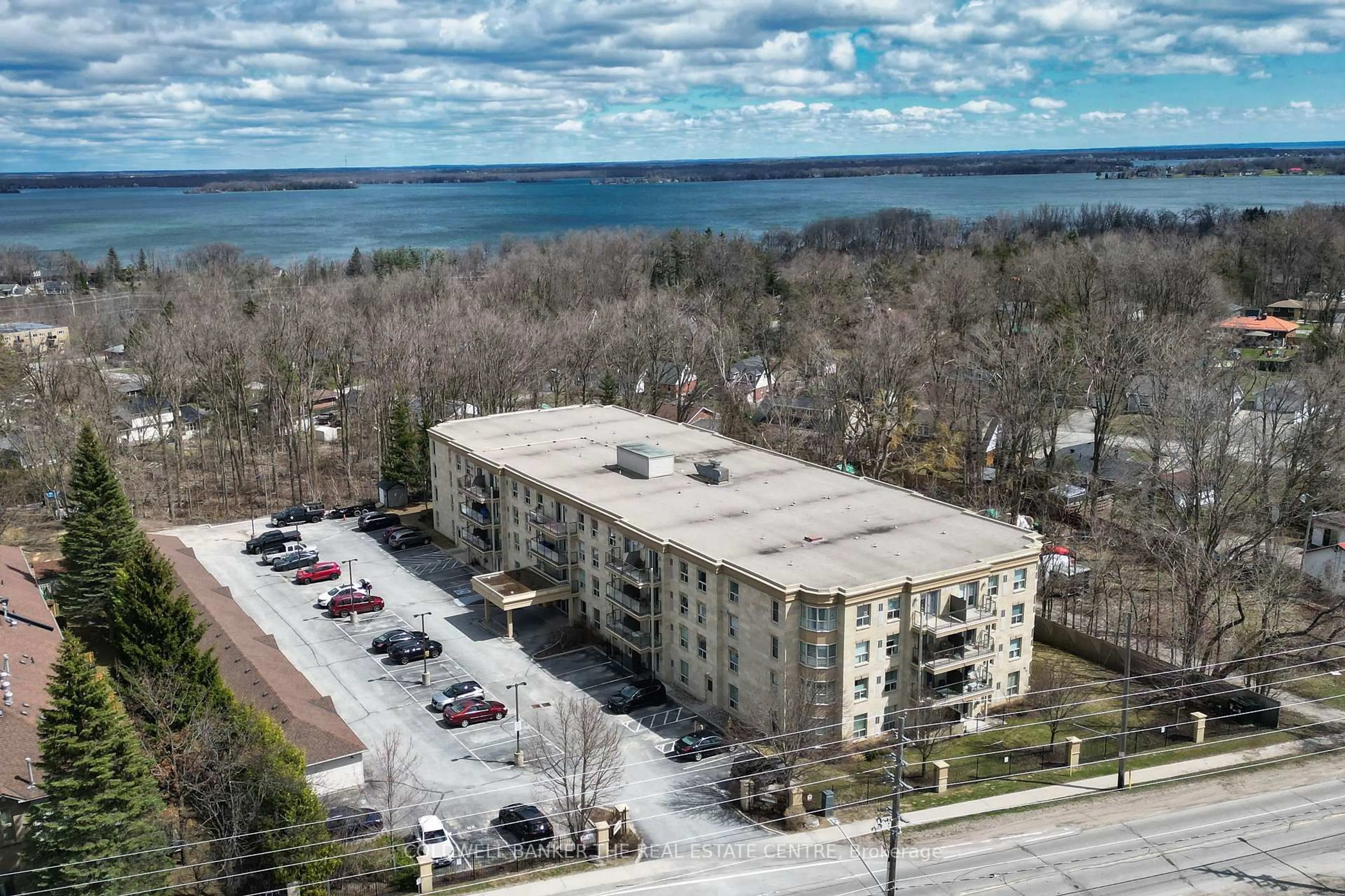 A pic from outside/outdoor area/front of a property/back of a property/a pic from drone, water/lake/river/ocean view for 486 Laclie St #304, Orillia Ontario L3V 4P9