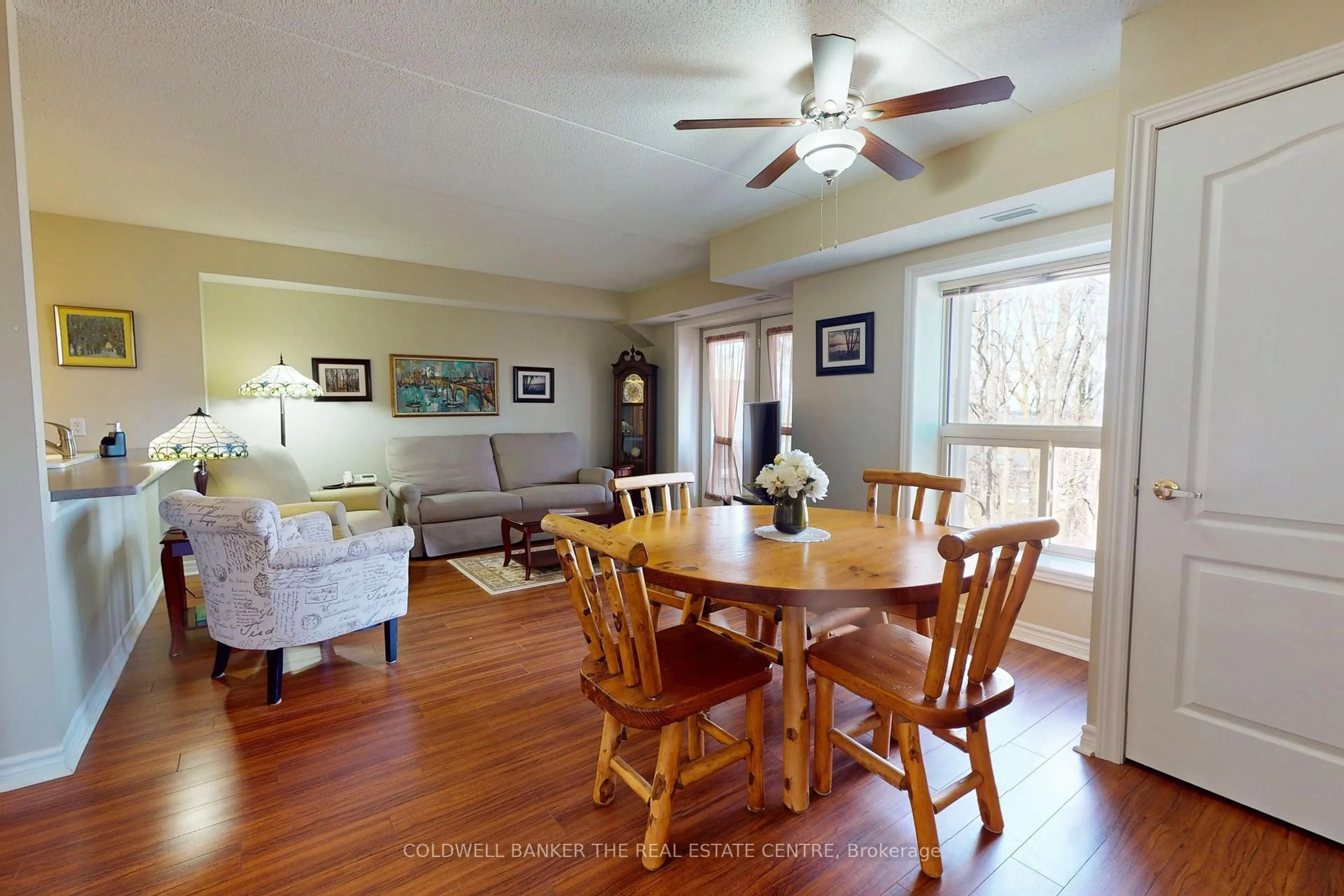 Living room with furniture, wood/laminate floor for 486 Laclie St #304, Orillia Ontario L3V 4P9