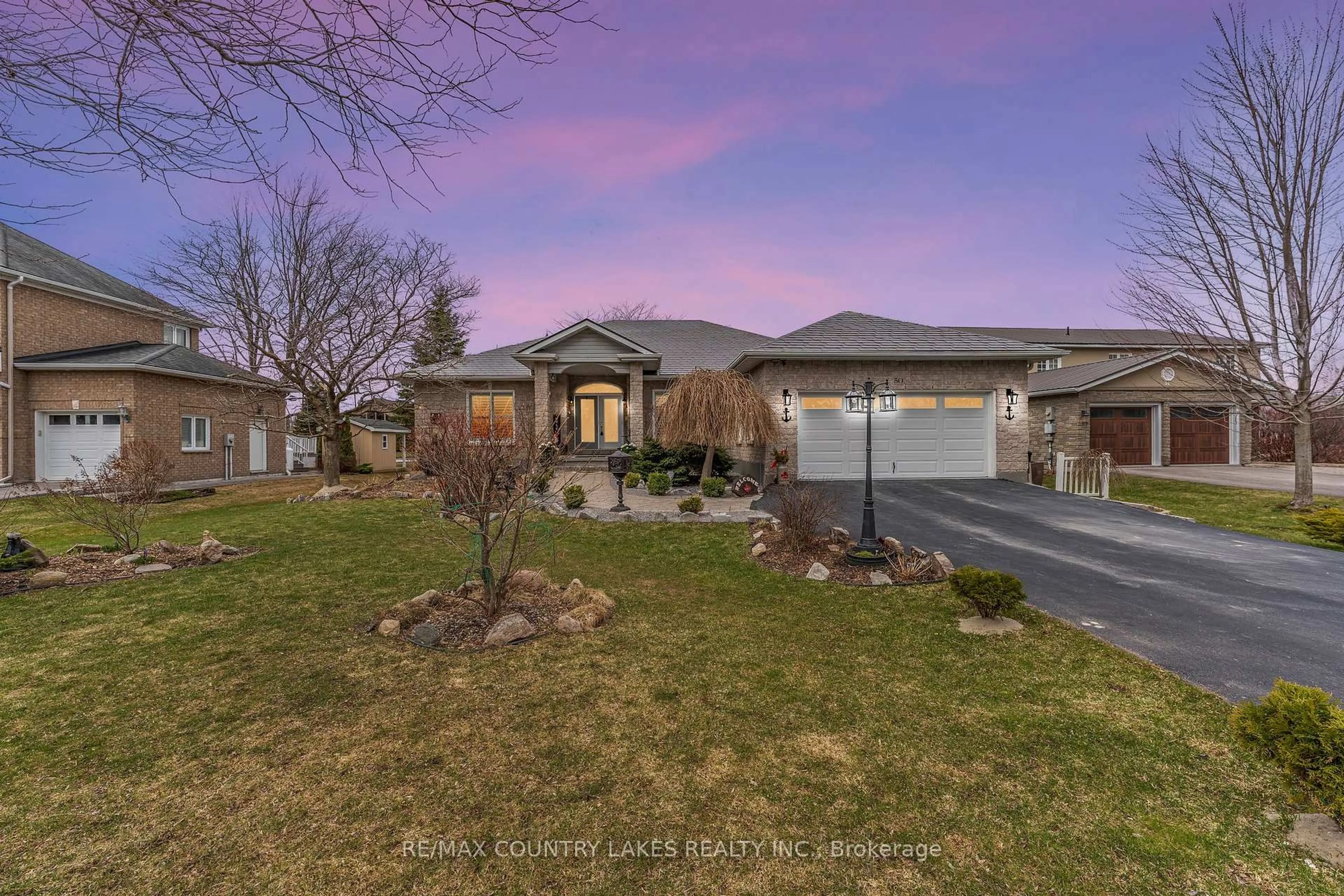 A pic from outside/outdoor area/front of a property/back of a property/a pic from drone, street for 50 Laguna Pkwy, Ramara Ontario L0K 1B0