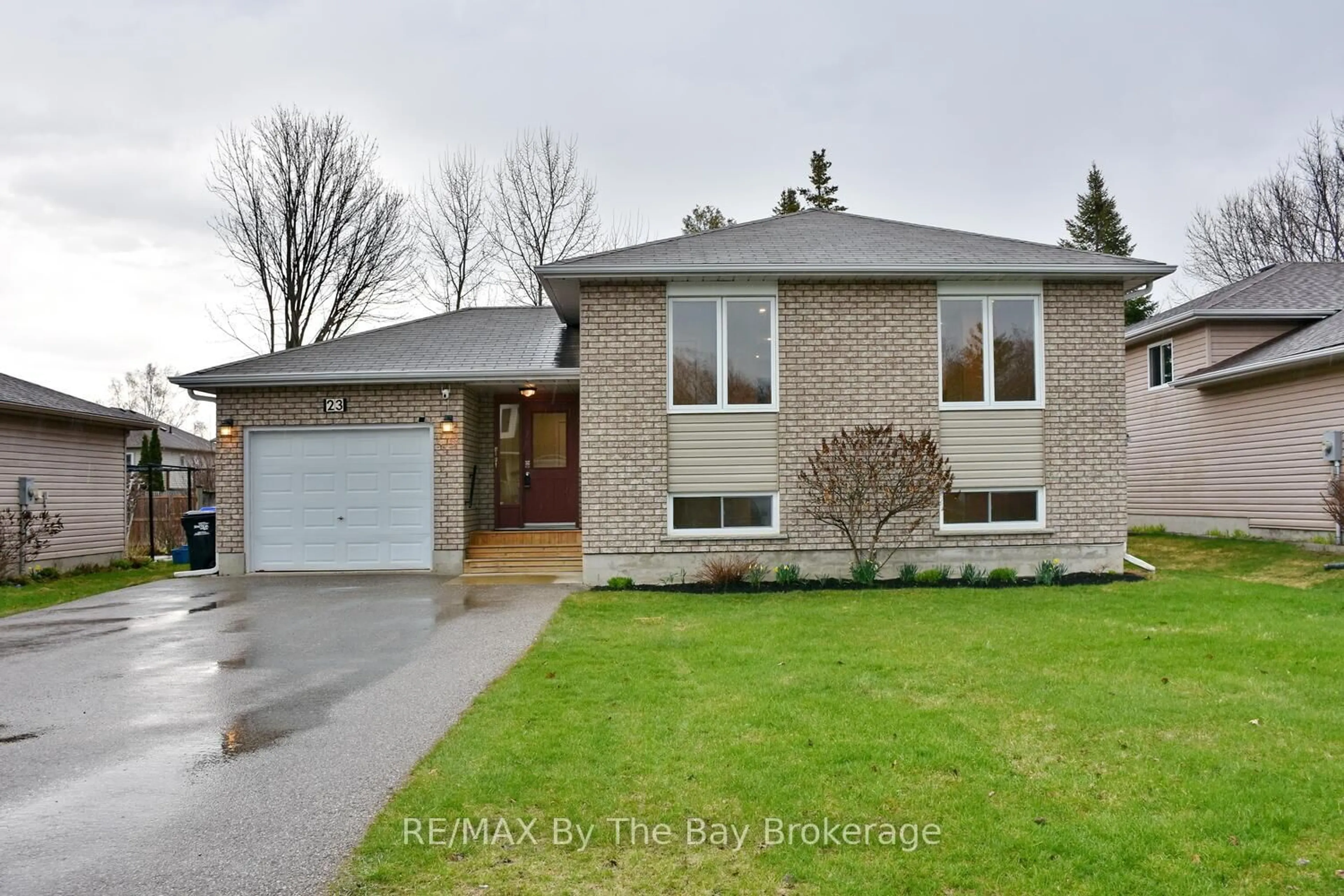 Home with brick exterior material, street for 23 Riverdale Dr, Wasaga Beach Ontario L9Z 1E9
