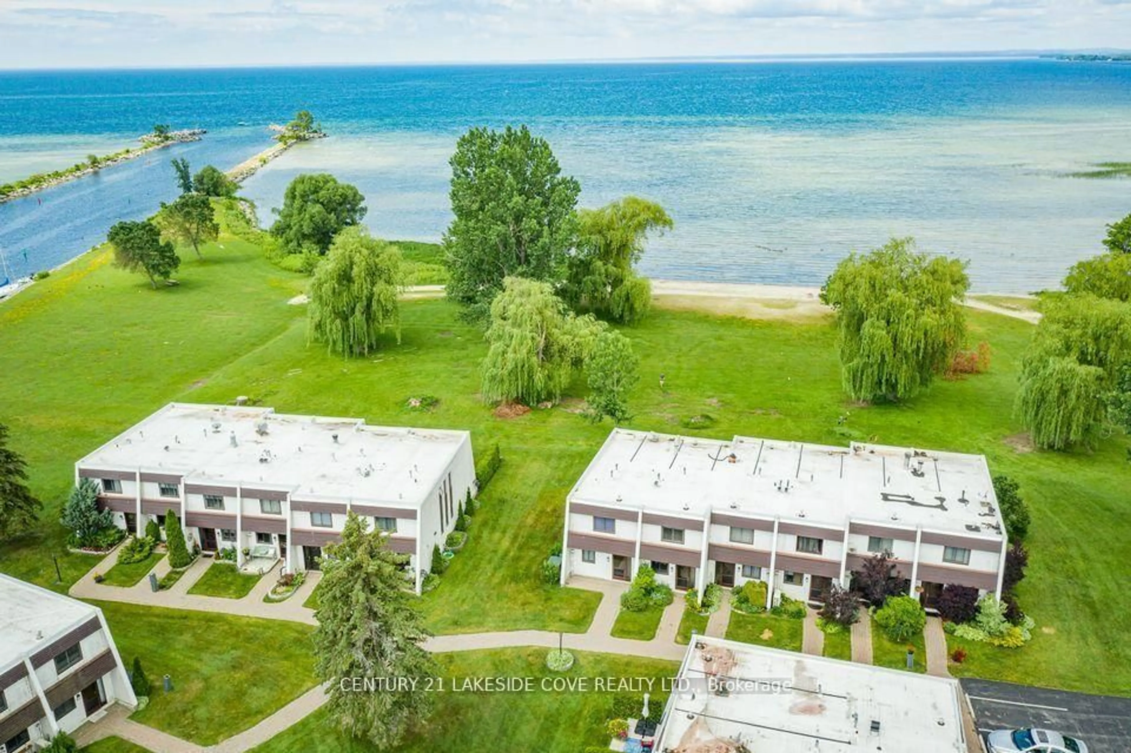 A pic from outside/outdoor area/front of a property/back of a property/a pic from drone, water/lake/river/ocean view for 1 Paradise Blvd #Unit 27, Ramara Ontario L0K 1B0