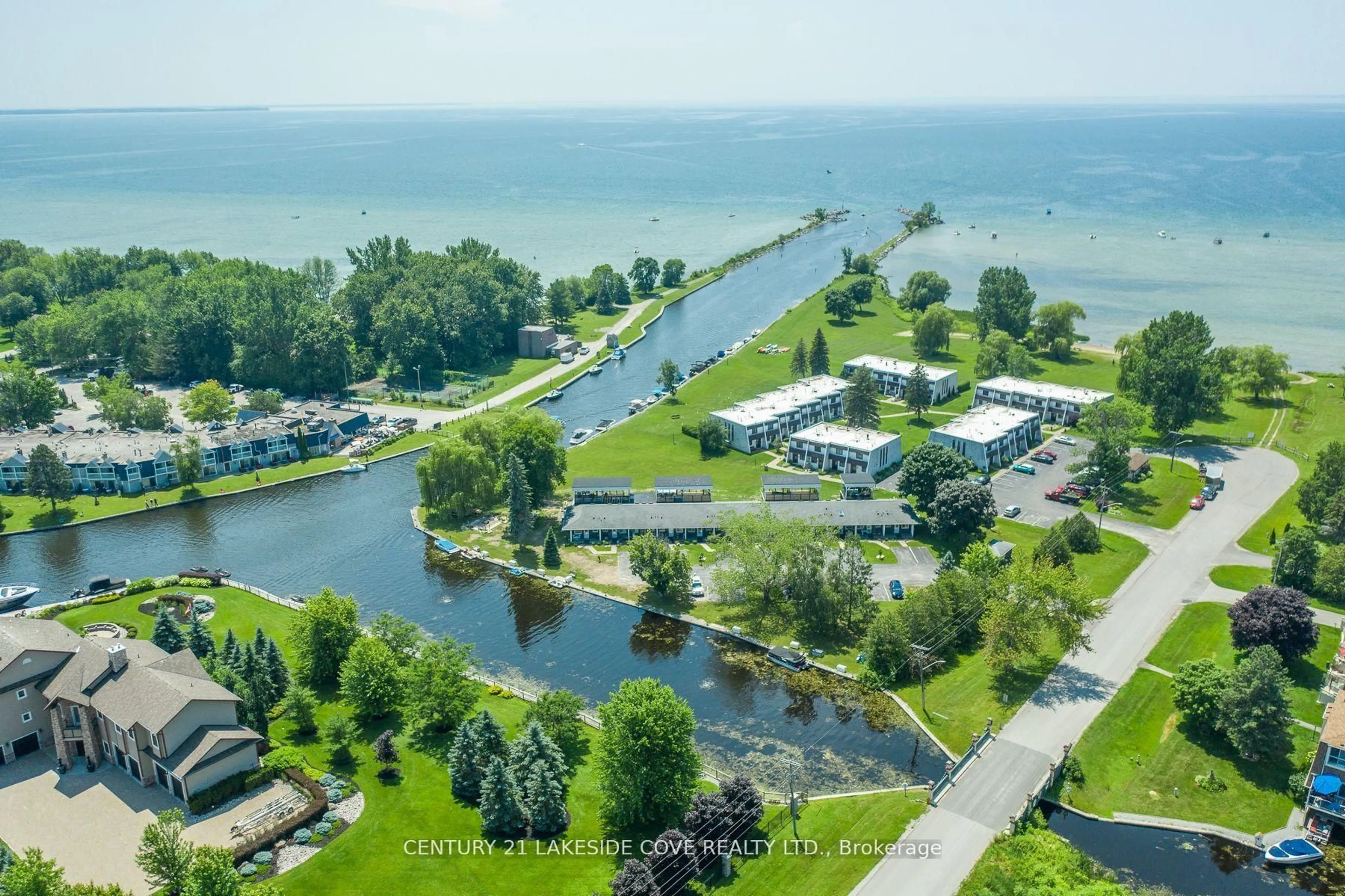 A pic from outside/outdoor area/front of a property/back of a property/a pic from drone, water/lake/river/ocean view for 1 Paradise Blvd #Unit 27, Ramara Ontario L0K 1B0