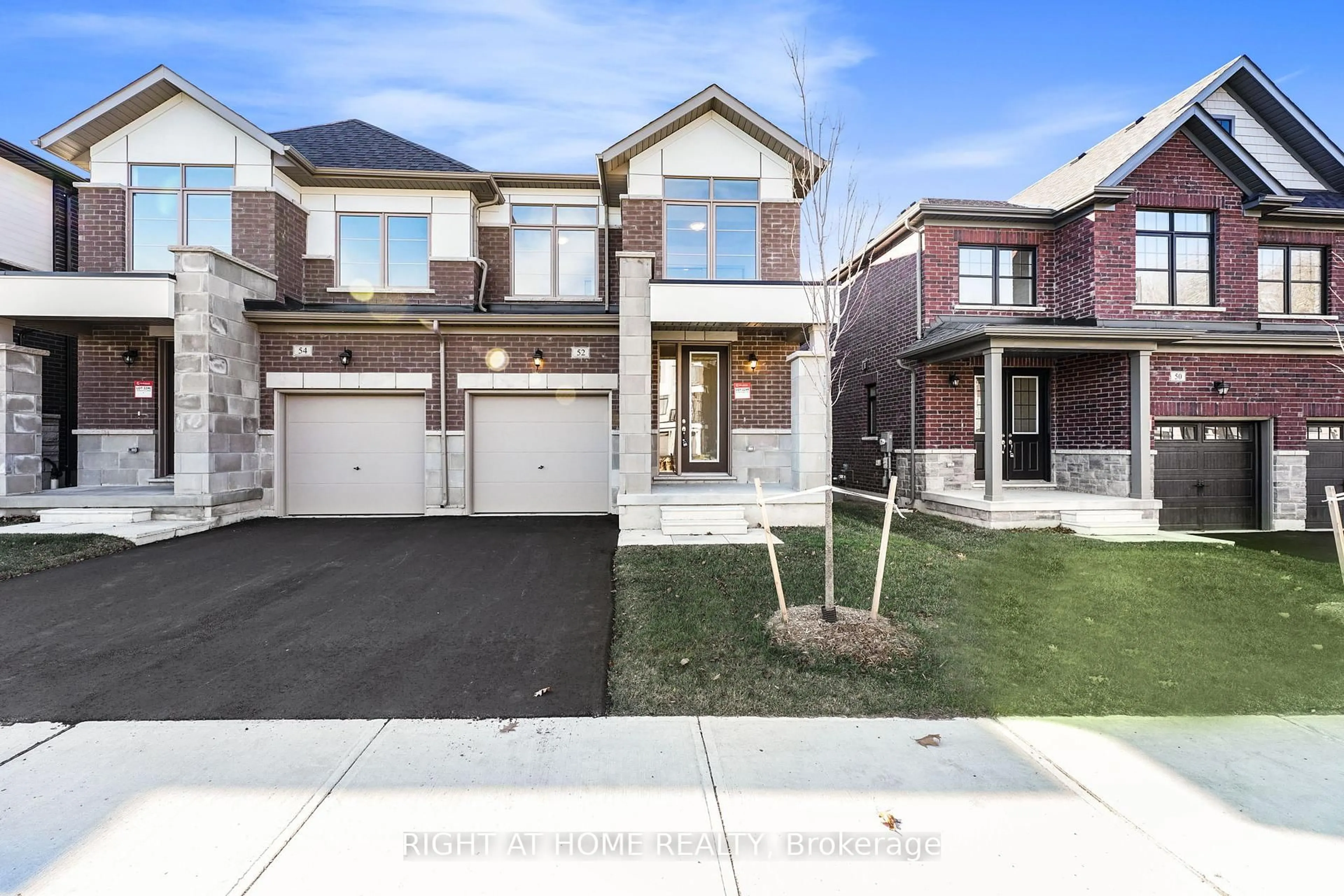 Home with brick exterior material, street for 52 Bearberry Rd, Springwater Ontario L9X 2E2