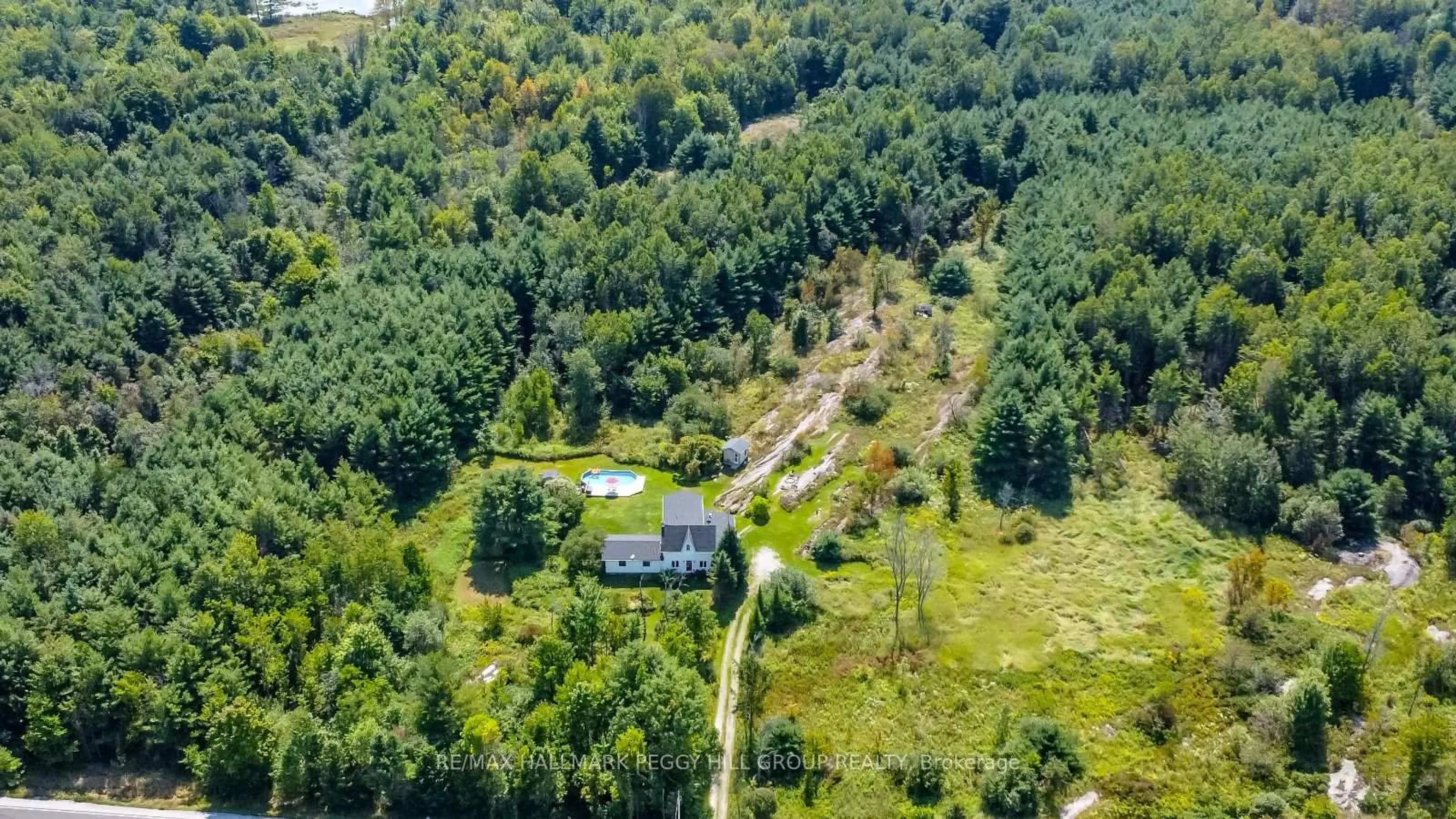 A pic from outside/outdoor area/front of a property/back of a property/a pic from drone, forest/trees view for 2161 Coopers Falls Rd, Severn Ontario L0K 2B0