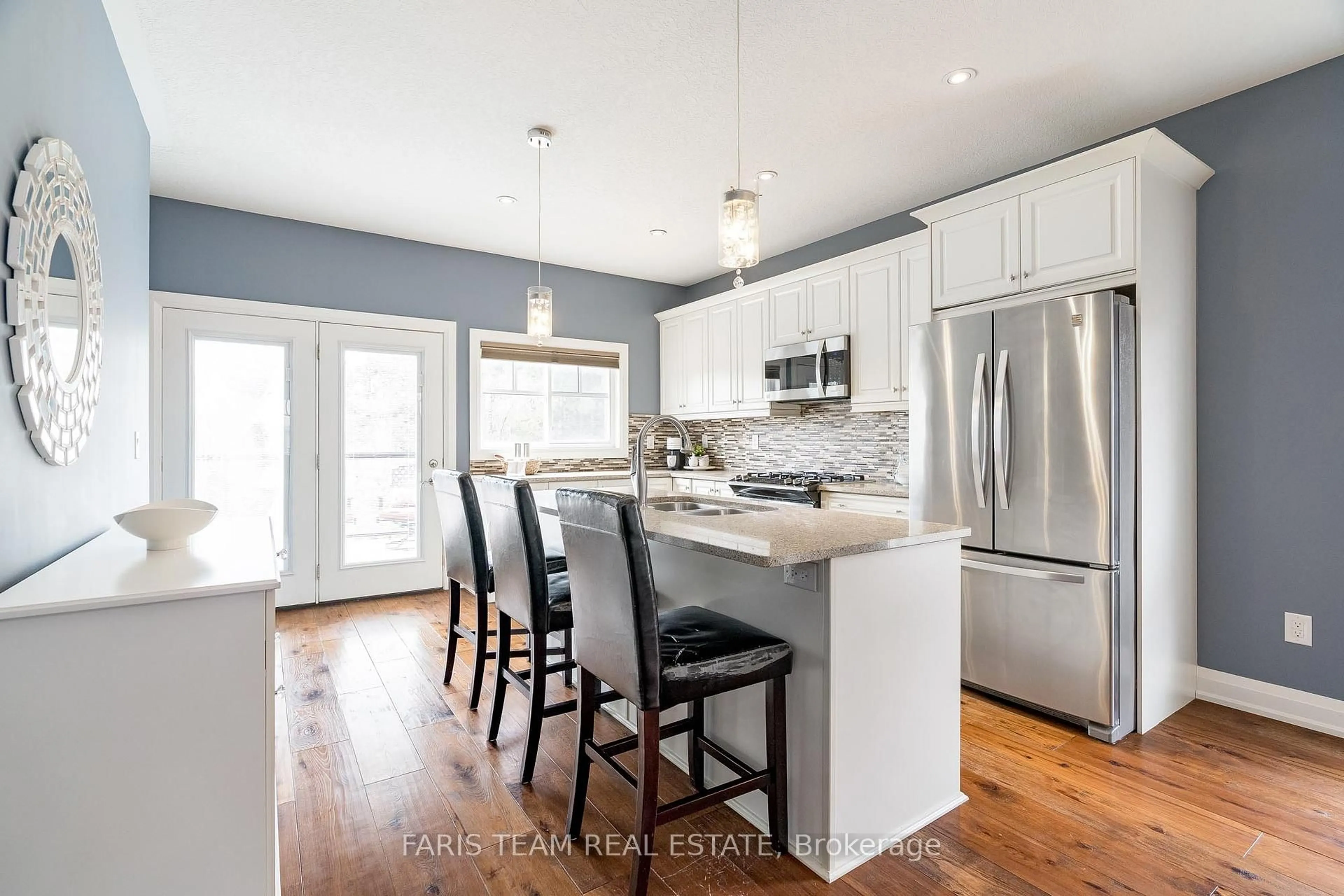 Open concept kitchen, wood/laminate floor for 78 Landscape Dr, Oro-Medonte Ontario L0L 2L0