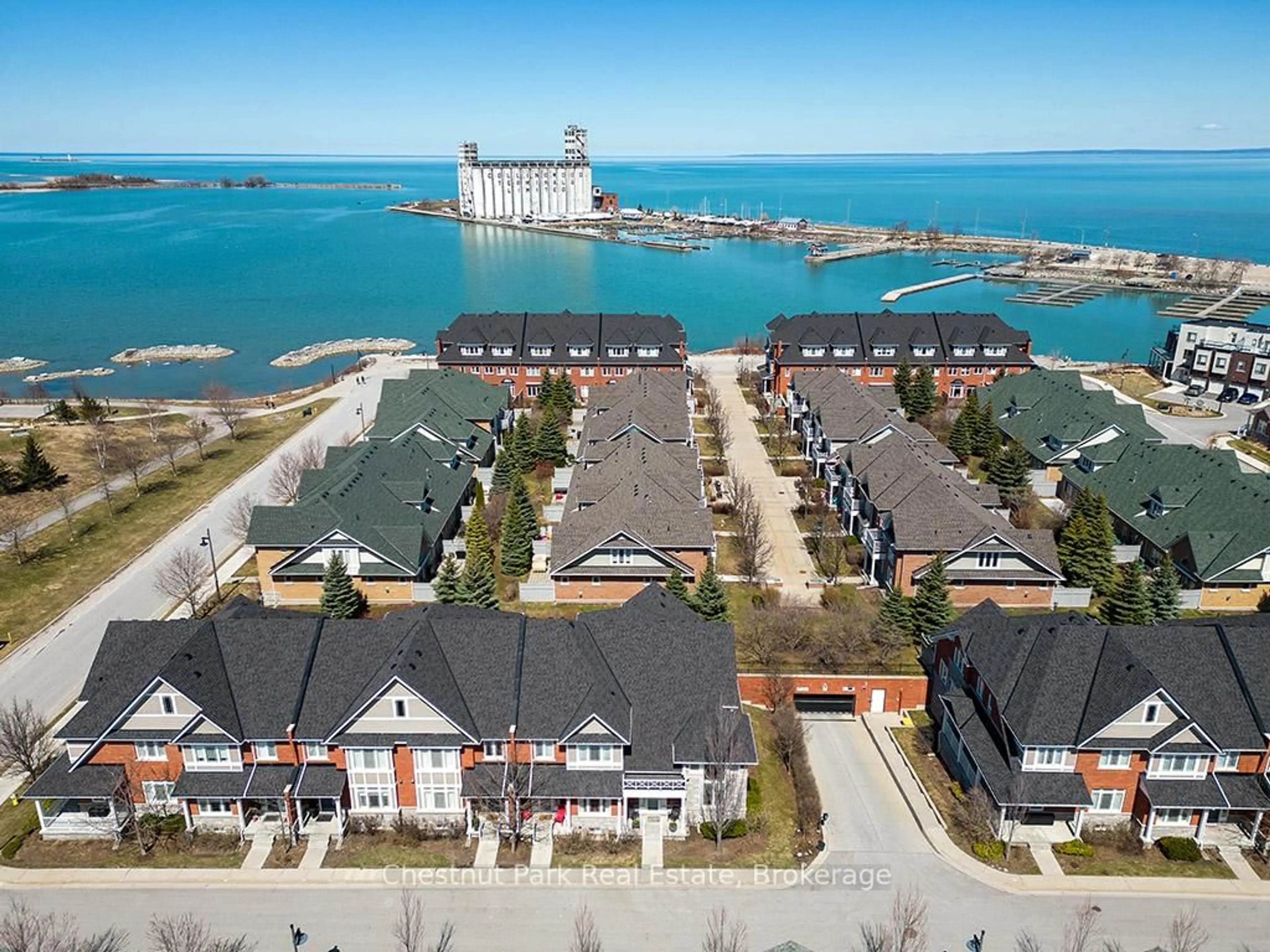 A pic from outside/outdoor area/front of a property/back of a property/a pic from drone, water/lake/river/ocean view for 13 Collship Lane, Collingwood Ontario L9Y 0J6