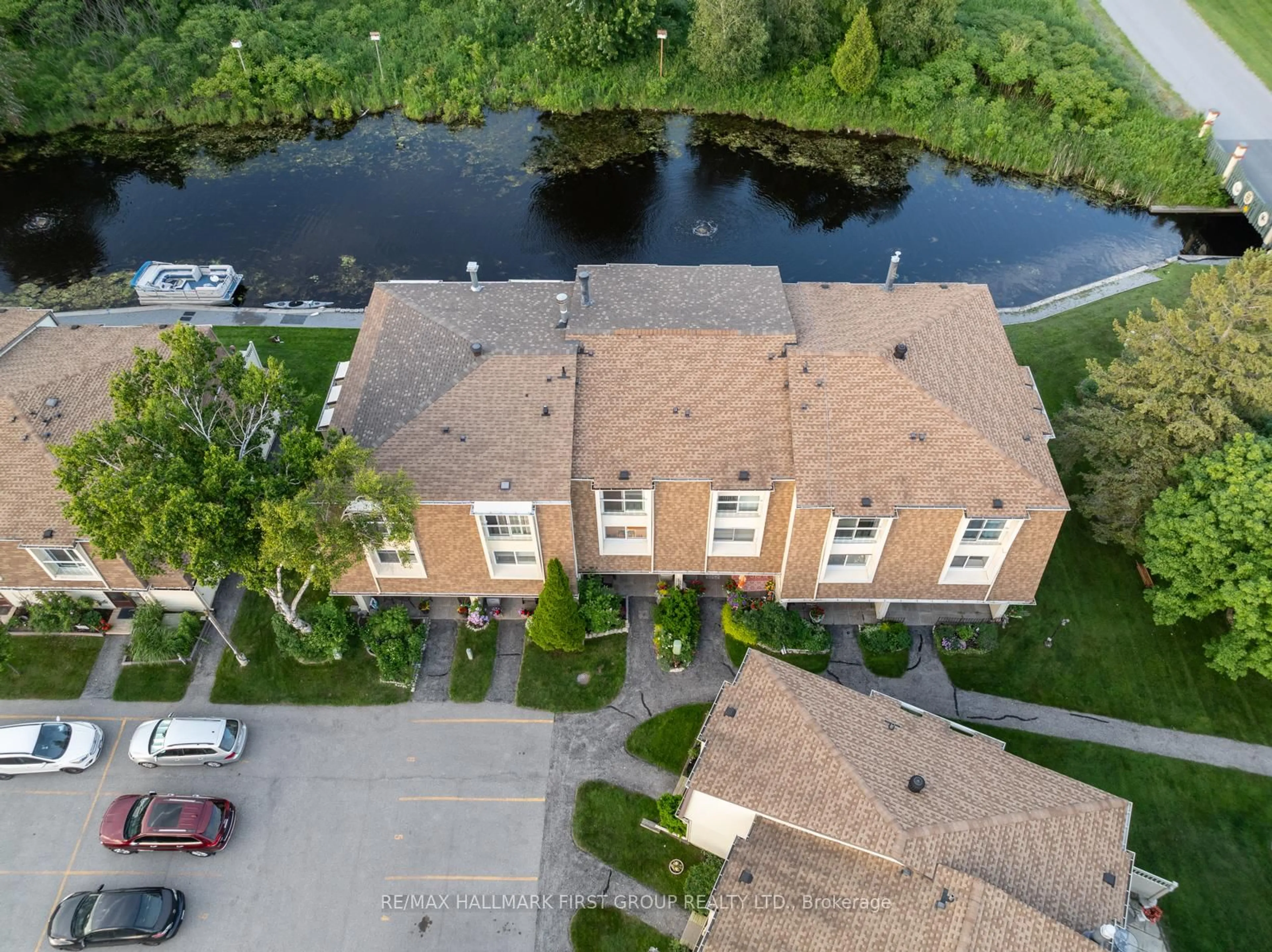 A pic from outside/outdoor area/front of a property/back of a property/a pic from drone, water/lake/river/ocean view for 4 Paradise Blvd #9, Ramara Ontario L0K 1B0