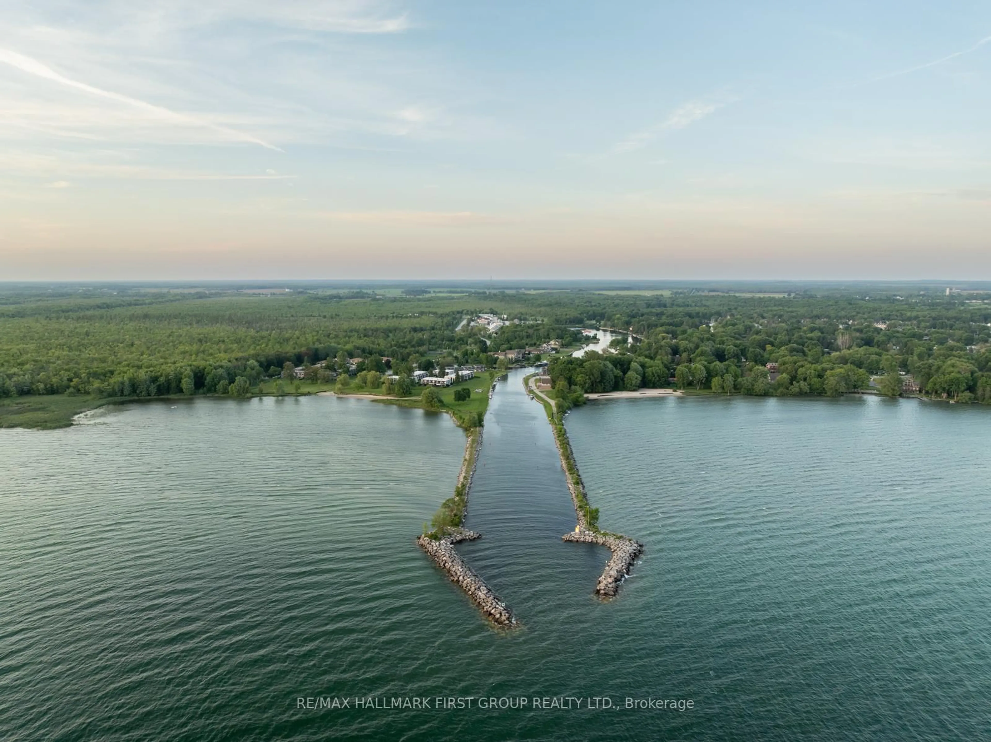 A pic from outside/outdoor area/front of a property/back of a property/a pic from drone, water/lake/river/ocean view for 4 Paradise Blvd #9, Ramara Ontario L0K 1B0