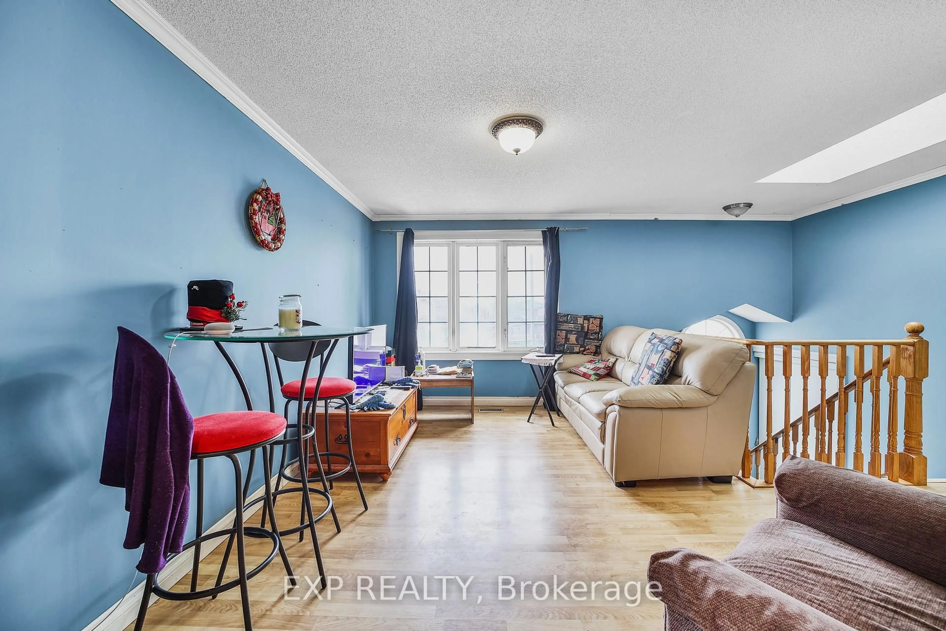 Living room with furniture, wood/laminate floor for 60 Ambler Way, Barrie Ontario L4M 7A6