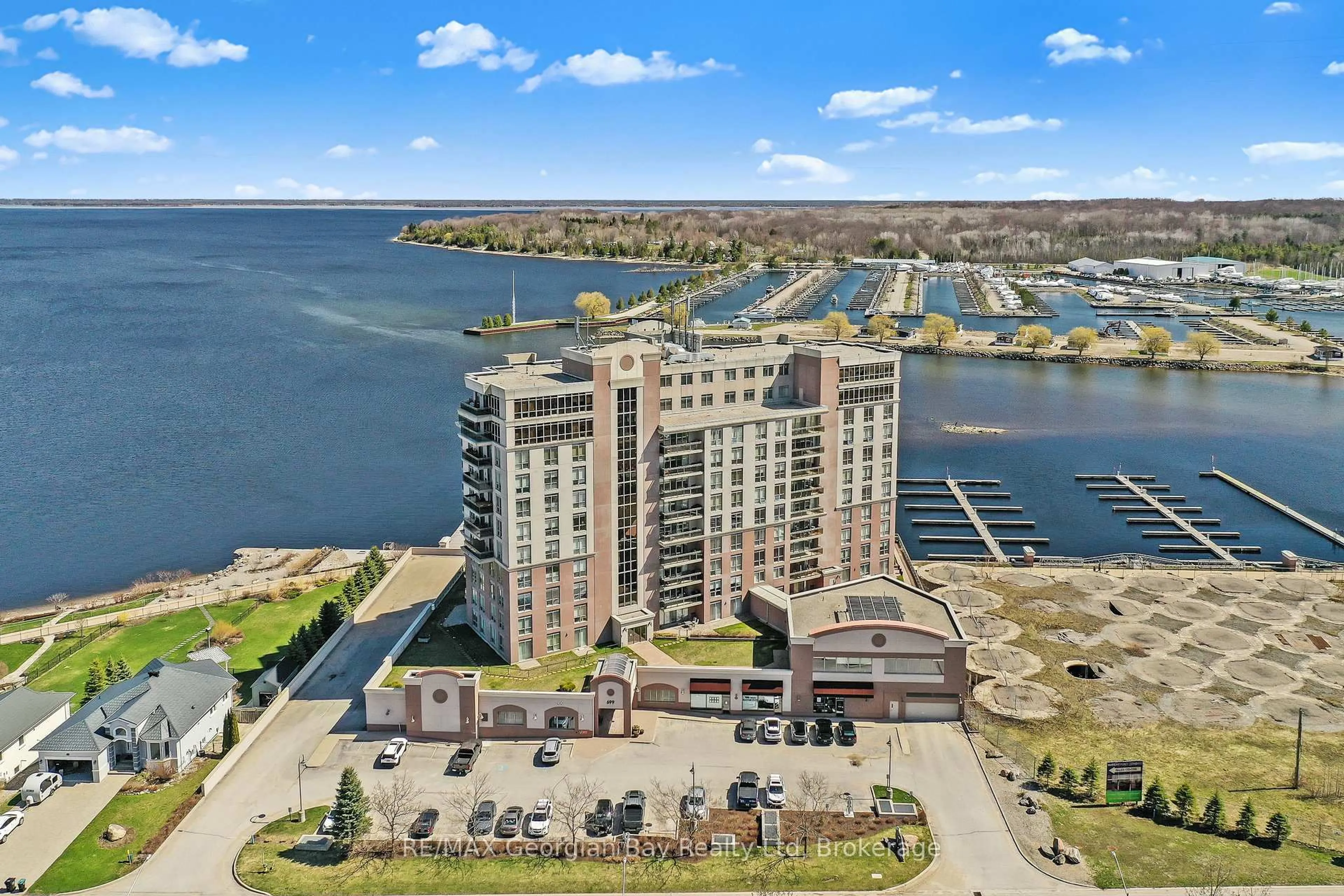 A pic from outside/outdoor area/front of a property/back of a property/a pic from drone, water/lake/river/ocean view for 699 Aberdeen Blvd #905, Midland Ontario L4R 5P2