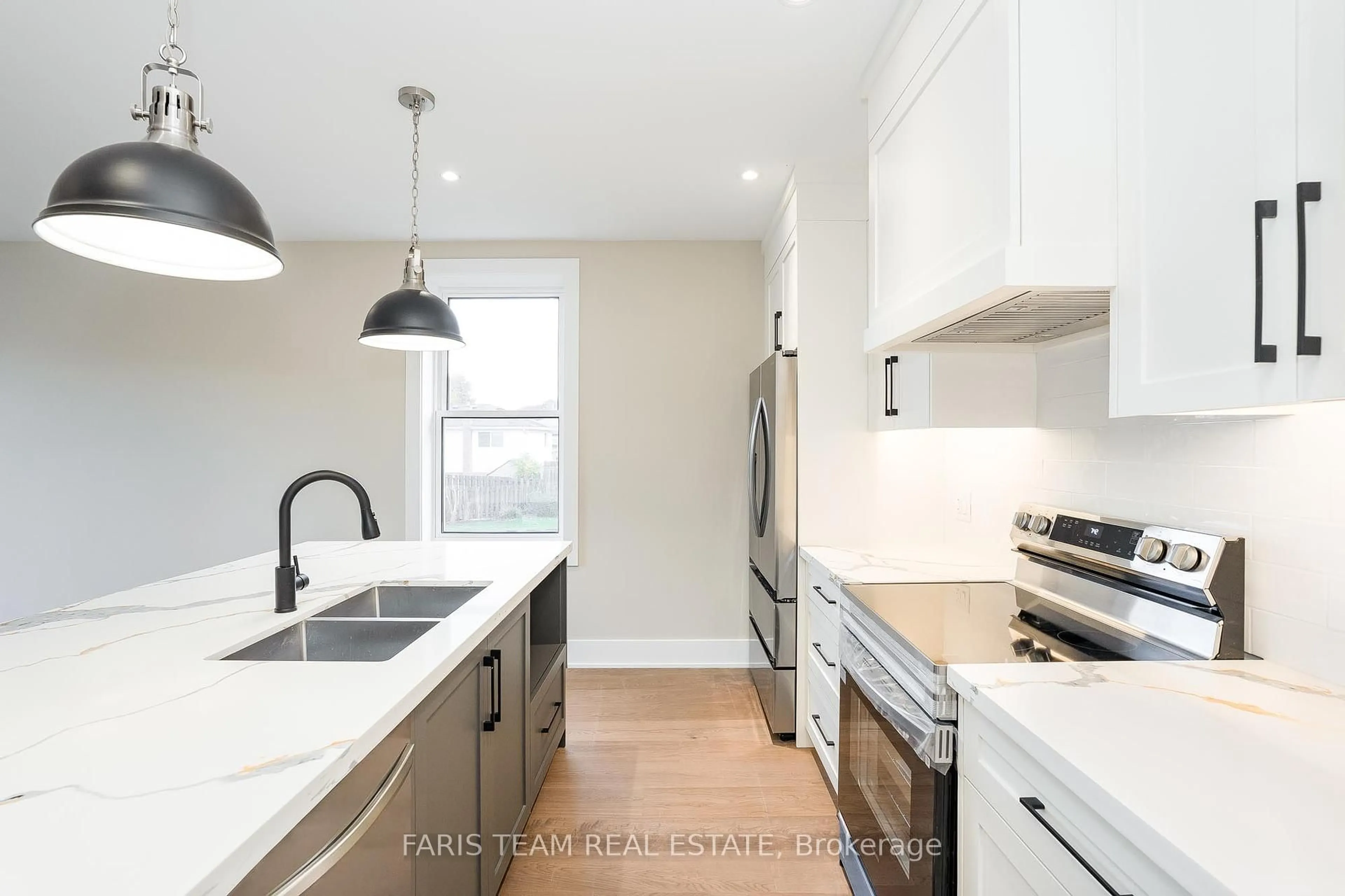 Open concept kitchen, wood/laminate floor for 9 Bertram Dr, Springwater Ontario L0L 1P0