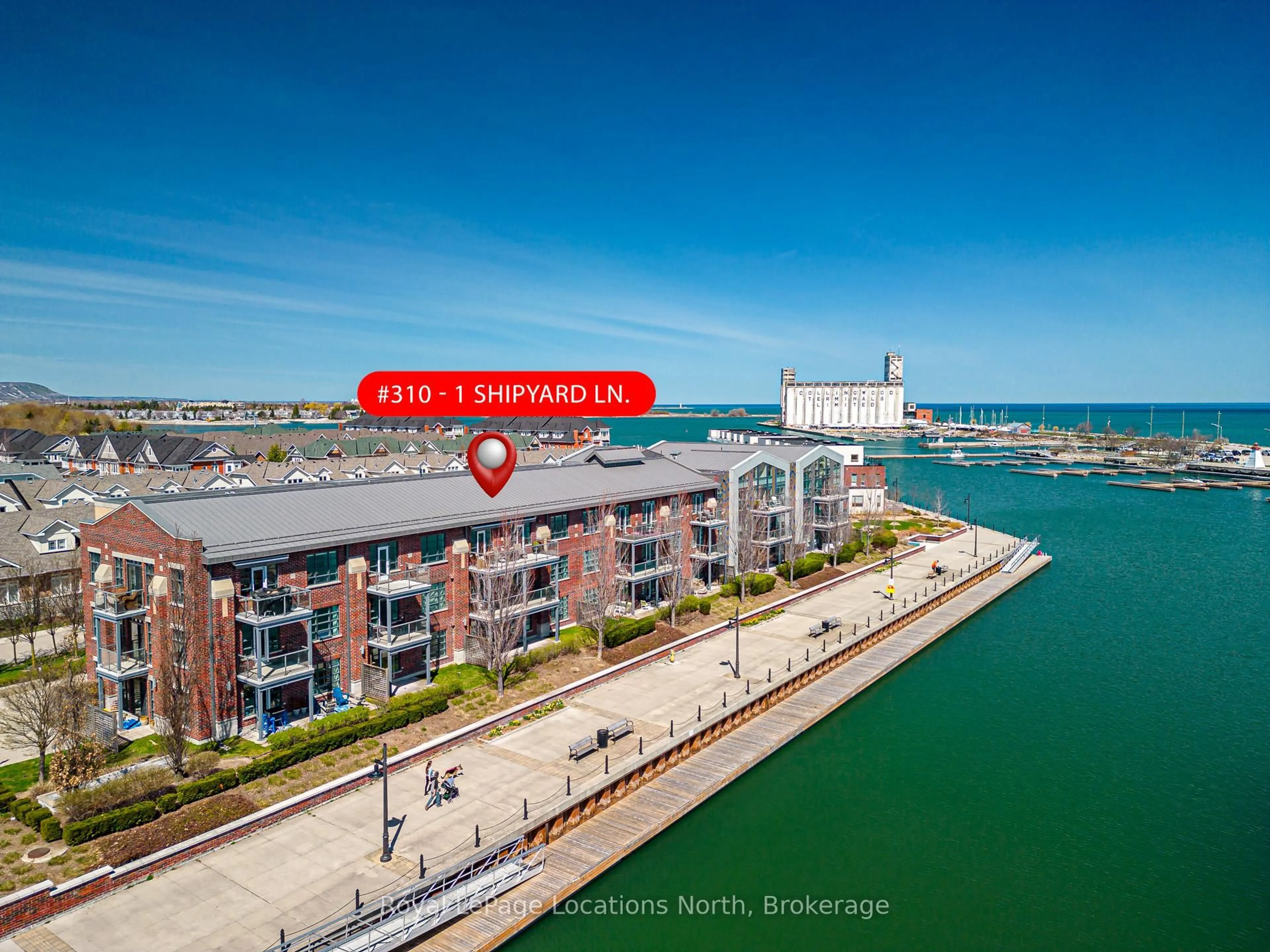 A pic from outside/outdoor area/front of a property/back of a property/a pic from drone, water/lake/river/ocean view for 1 Shipyard Lane #310, Collingwood Ontario L9Y 0W2