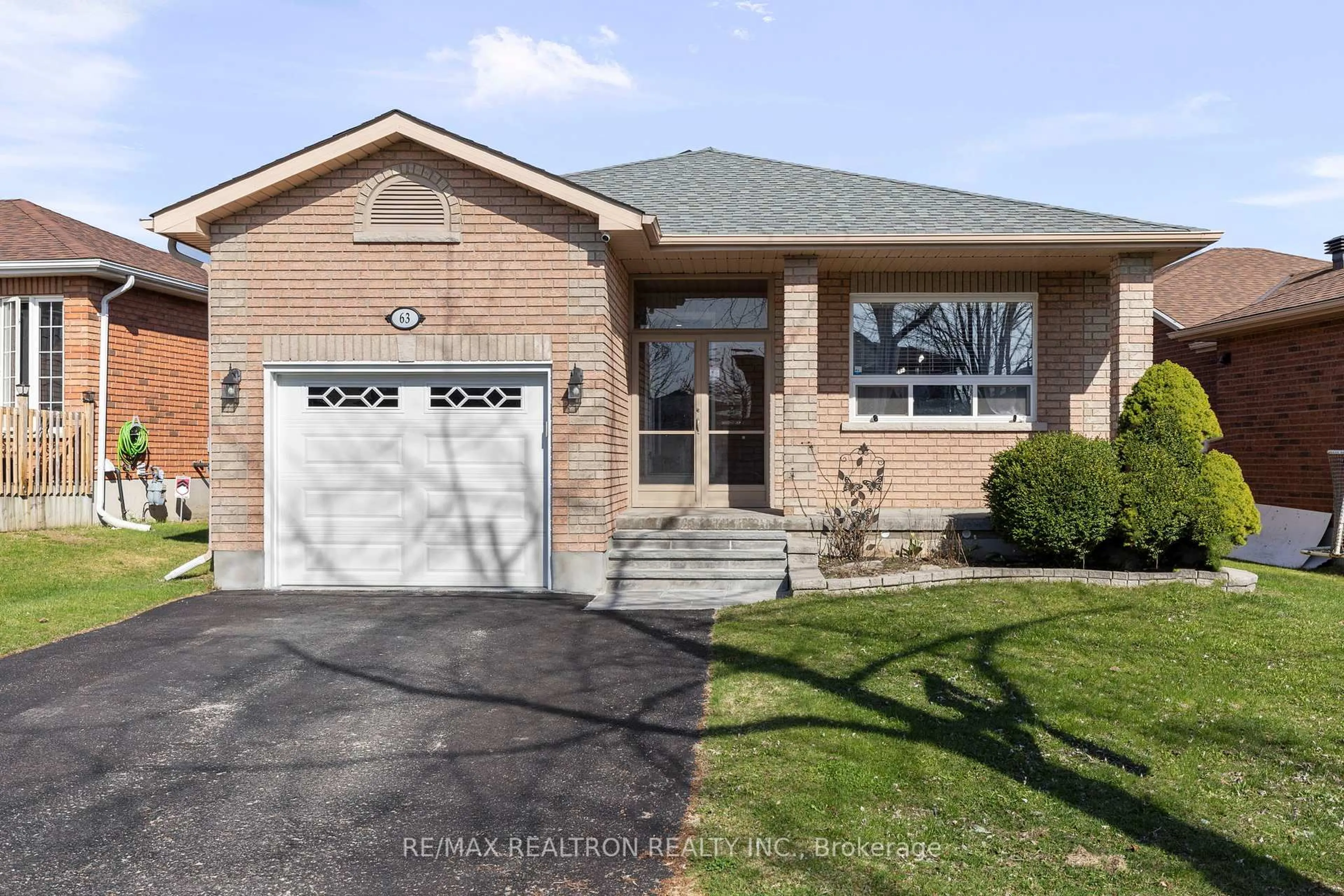 Home with brick exterior material, street for 63 Butternut Dr, Barrie Ontario L4N 9Z8