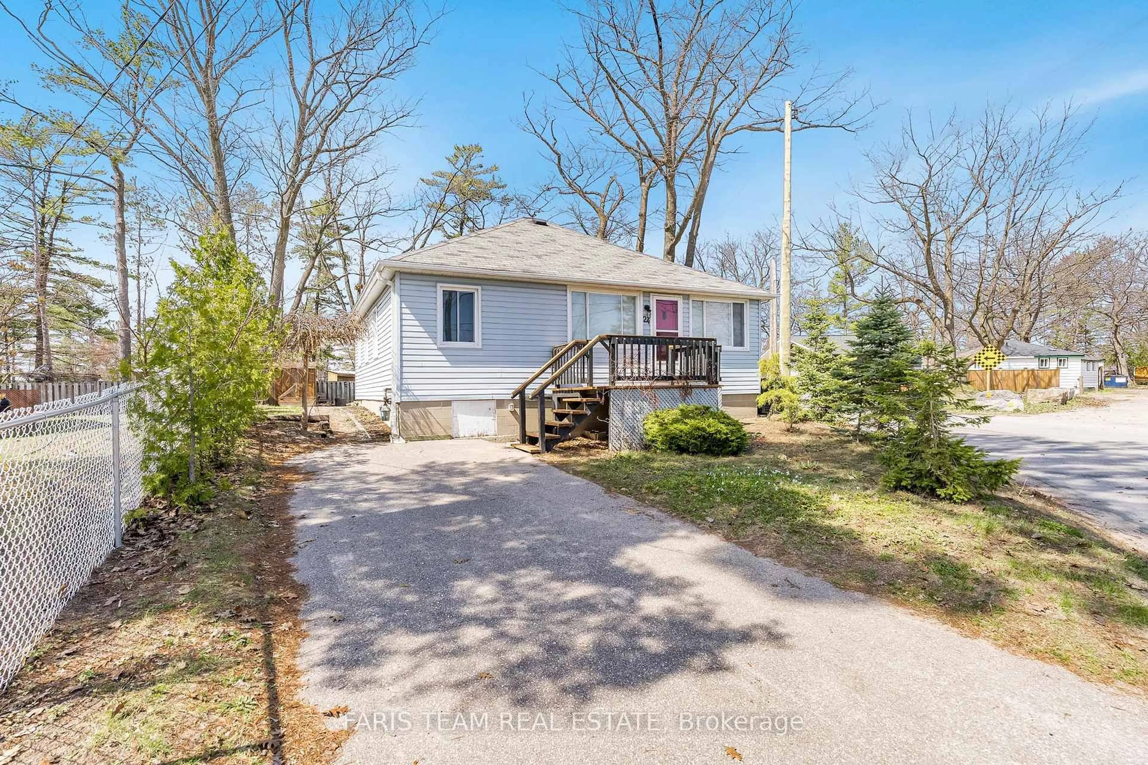 Home with vinyl exterior material, street for 24 Old Mosley St, Wasaga Beach Ontario L9Z 2J8