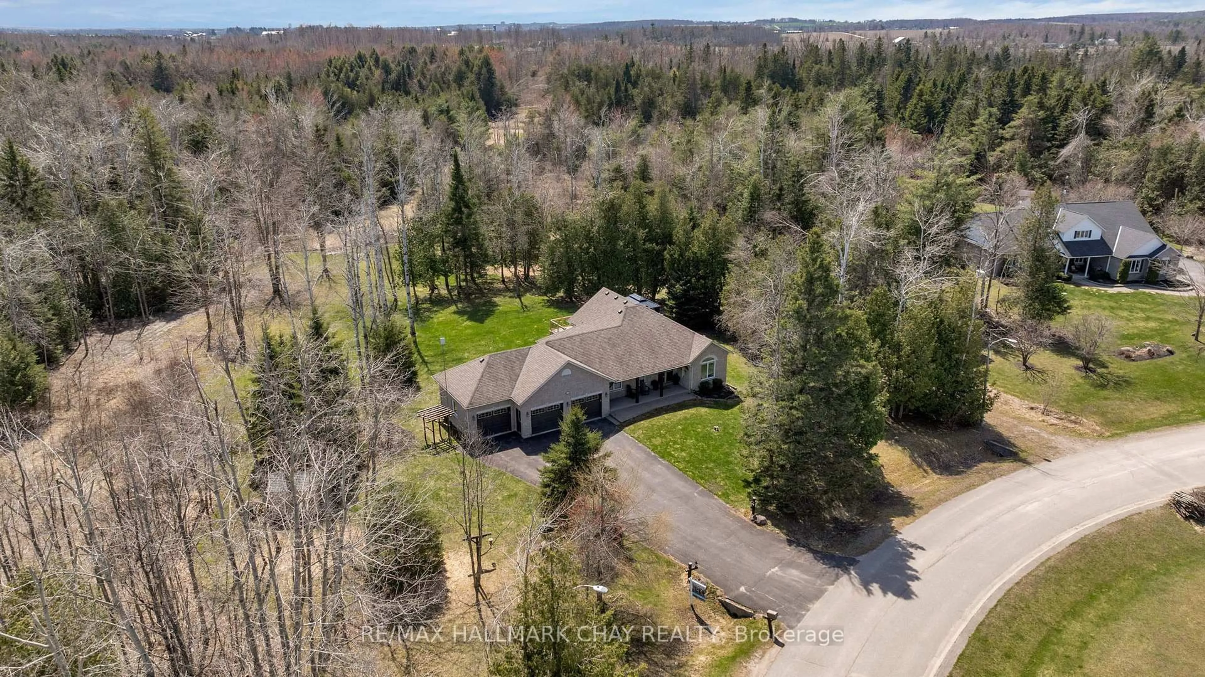 A pic from outside/outdoor area/front of a property/back of a property/a pic from drone, forest/trees view for 12 Martinbrook Cres, Oro-Medonte Ontario L0L 2L0