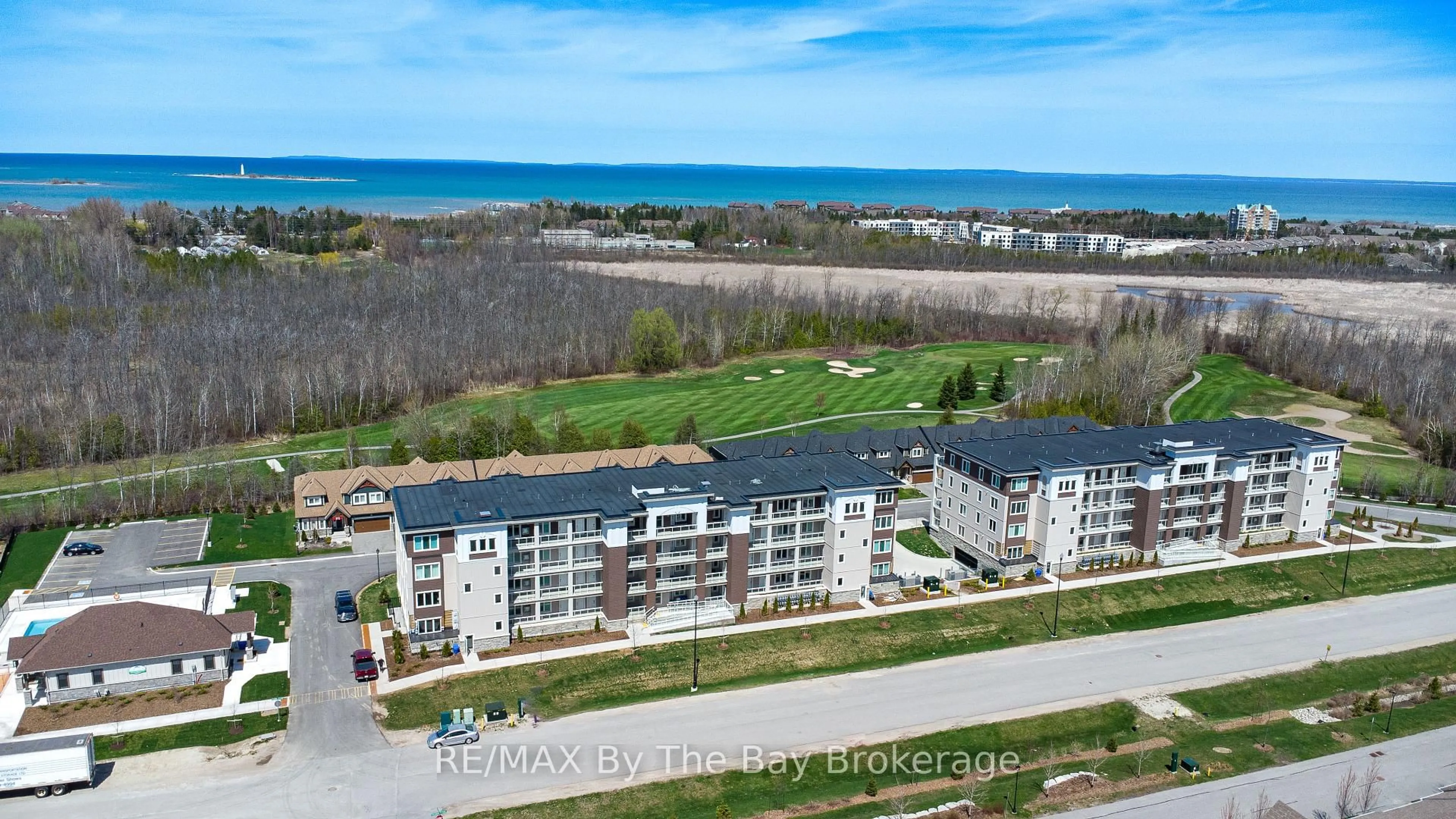 A pic from outside/outdoor area/front of a property/back of a property/a pic from drone, water/lake/river/ocean view for 17 Spooner Cres #205, Collingwood Ontario L9Y 1T3