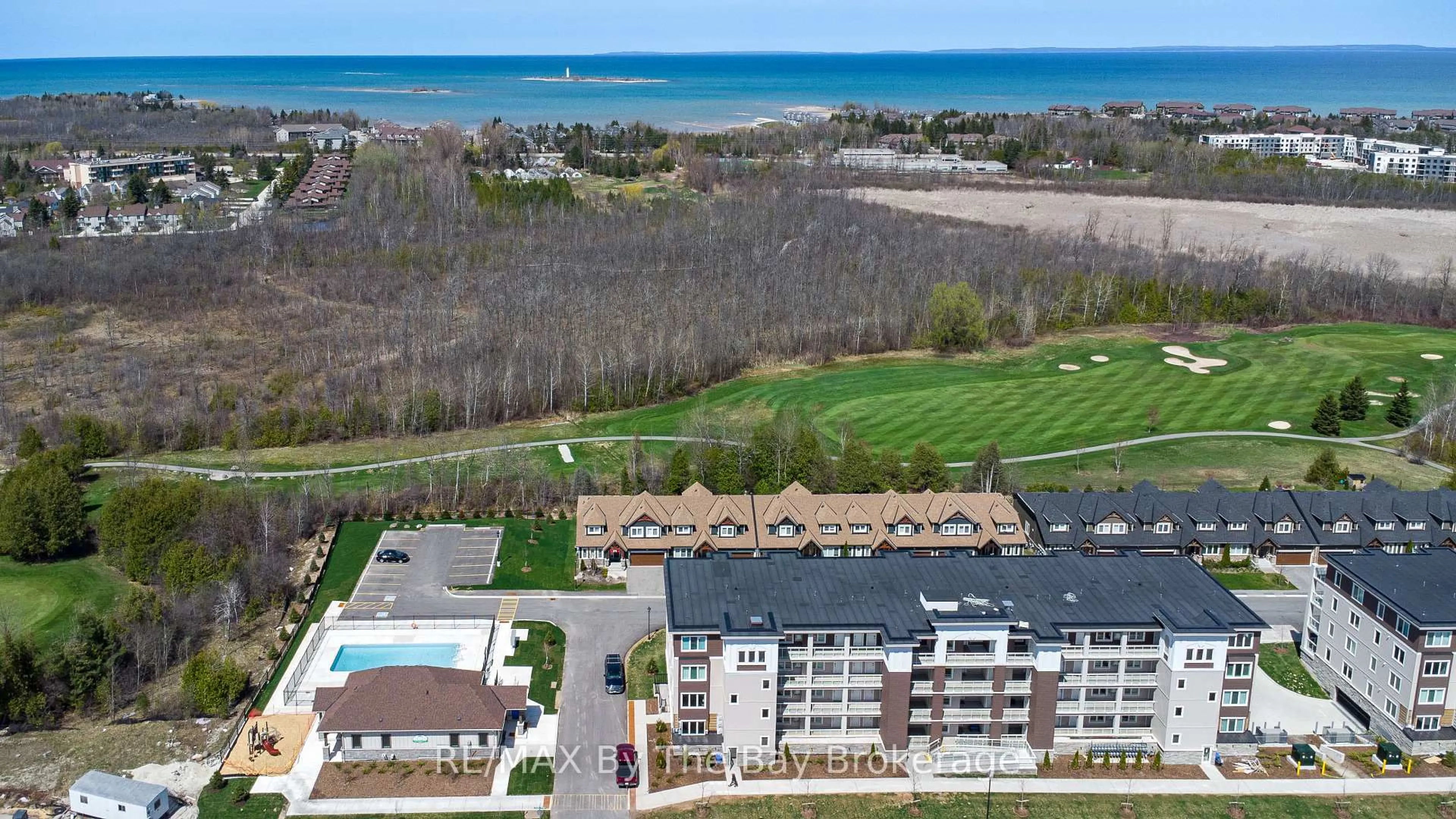 A pic from outside/outdoor area/front of a property/back of a property/a pic from drone, water/lake/river/ocean view for 17 Spooner Cres #205, Collingwood Ontario L9Y 1T3