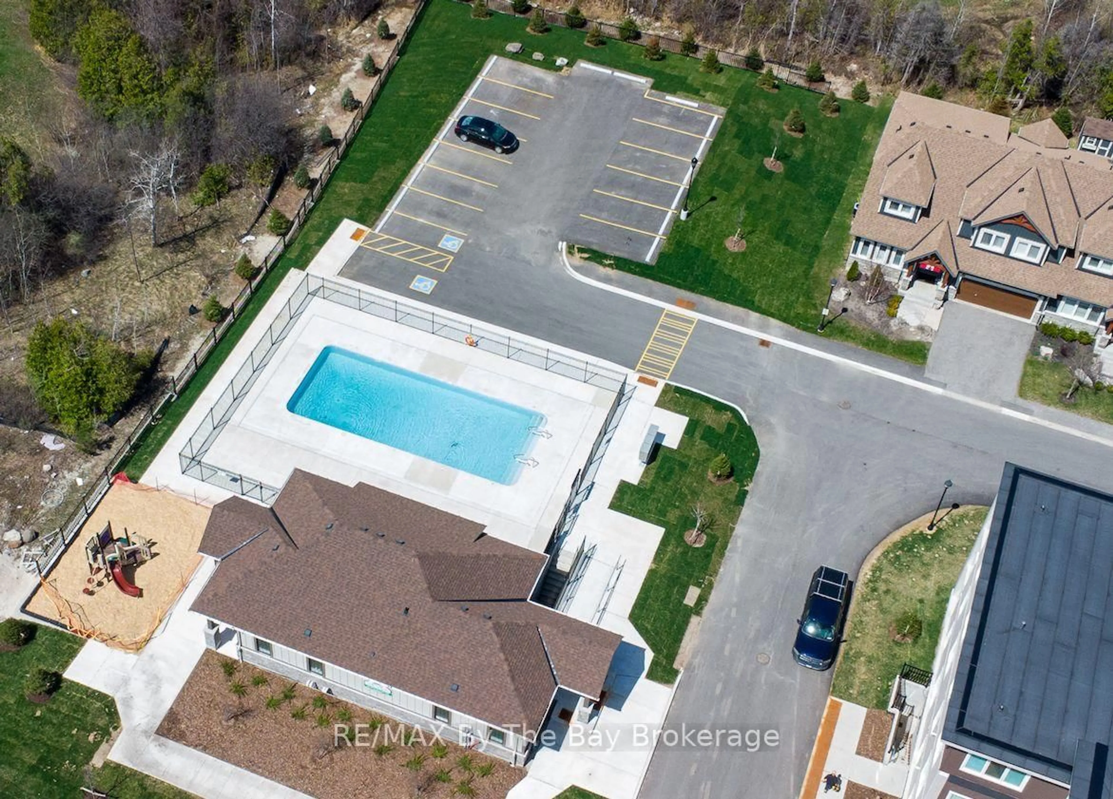 A pic from outside/outdoor area/front of a property/back of a property/a pic from drone, street for 17 Spooner Cres #205, Collingwood Ontario L9Y 1T3