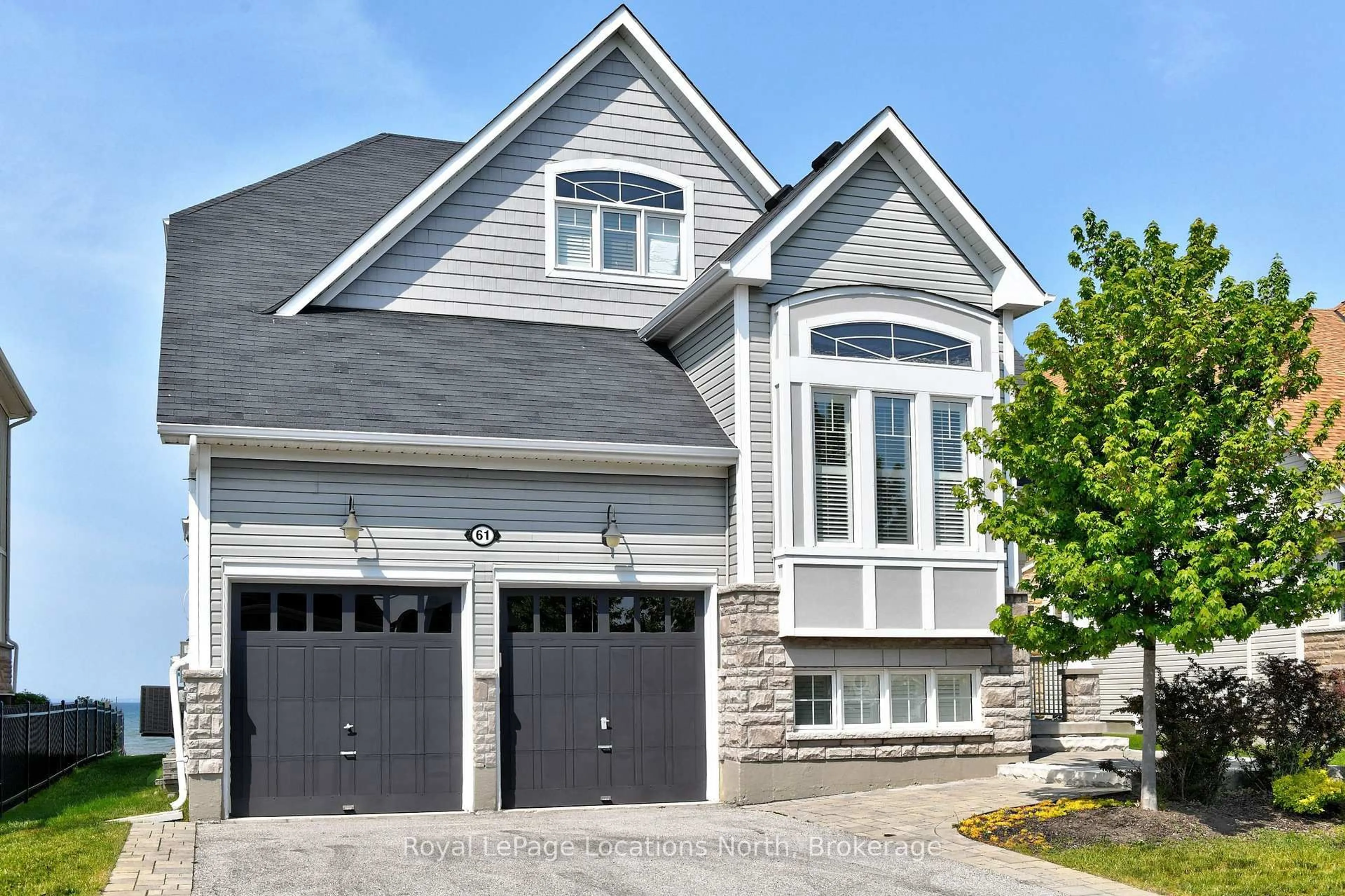 Home with brick exterior material, street for 61 Waterview Rd, Wasaga Beach Ontario L9Z 0E9