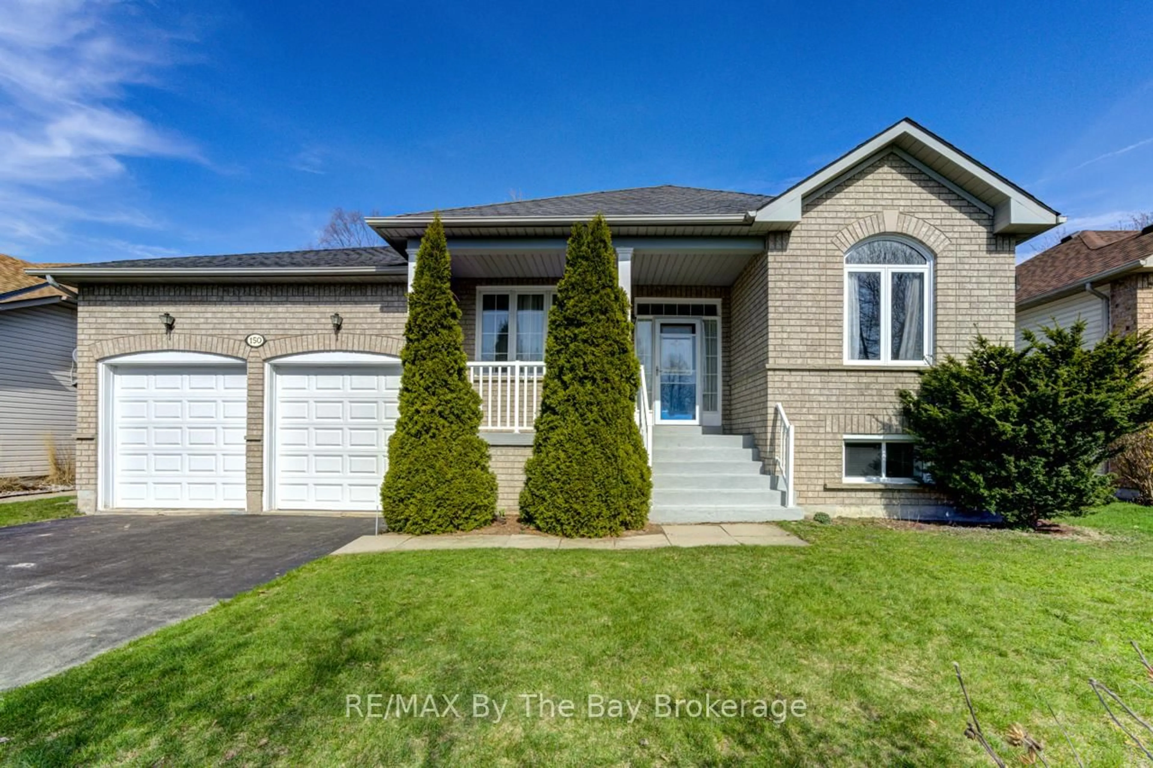 Home with brick exterior material, street for 150 Silver Birch Ave, Wasaga Beach Ontario L9Z 1N3