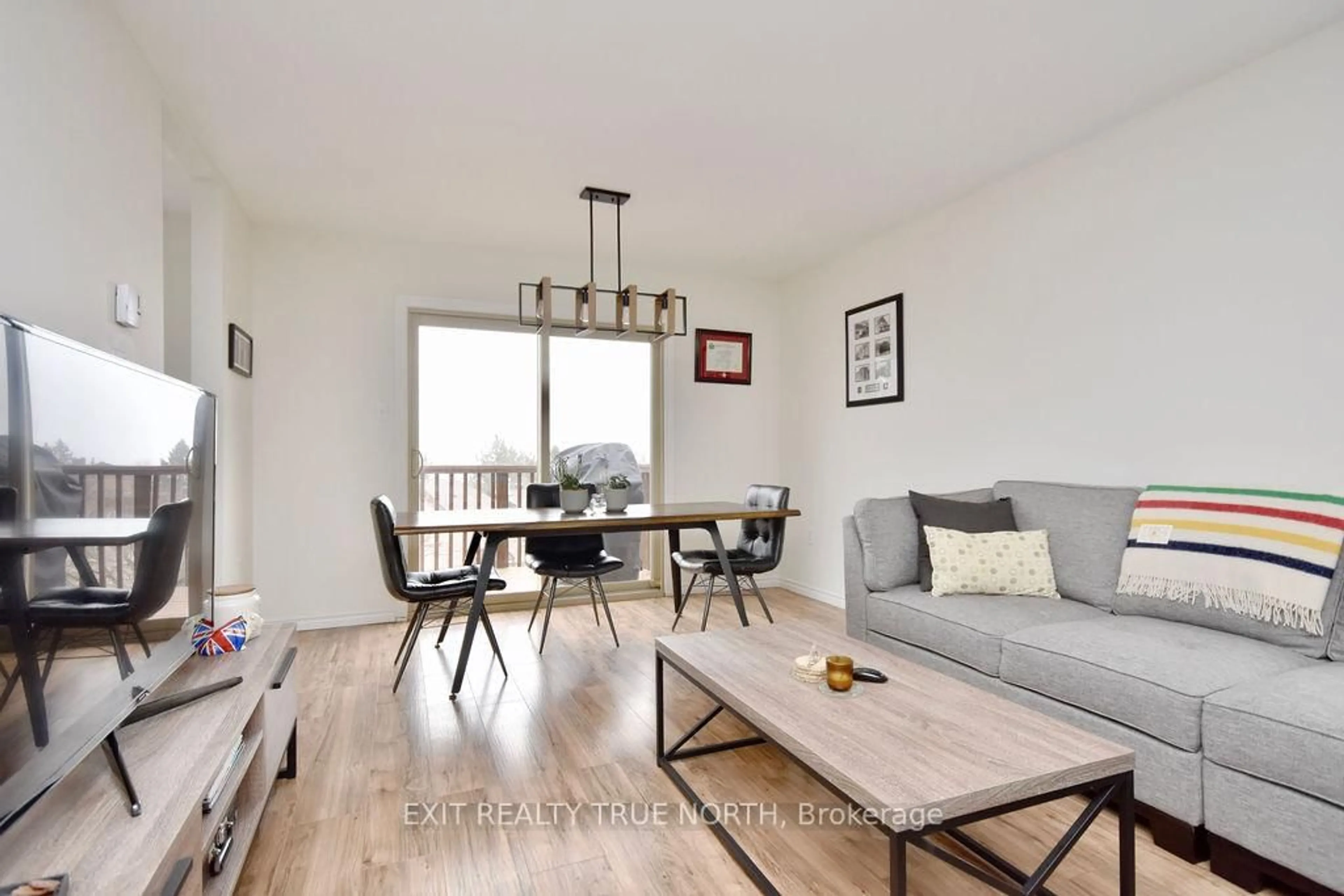 Living room with furniture, wood/laminate floor for 3 Sawmill Rd #7, Barrie Ontario L4N 6X3