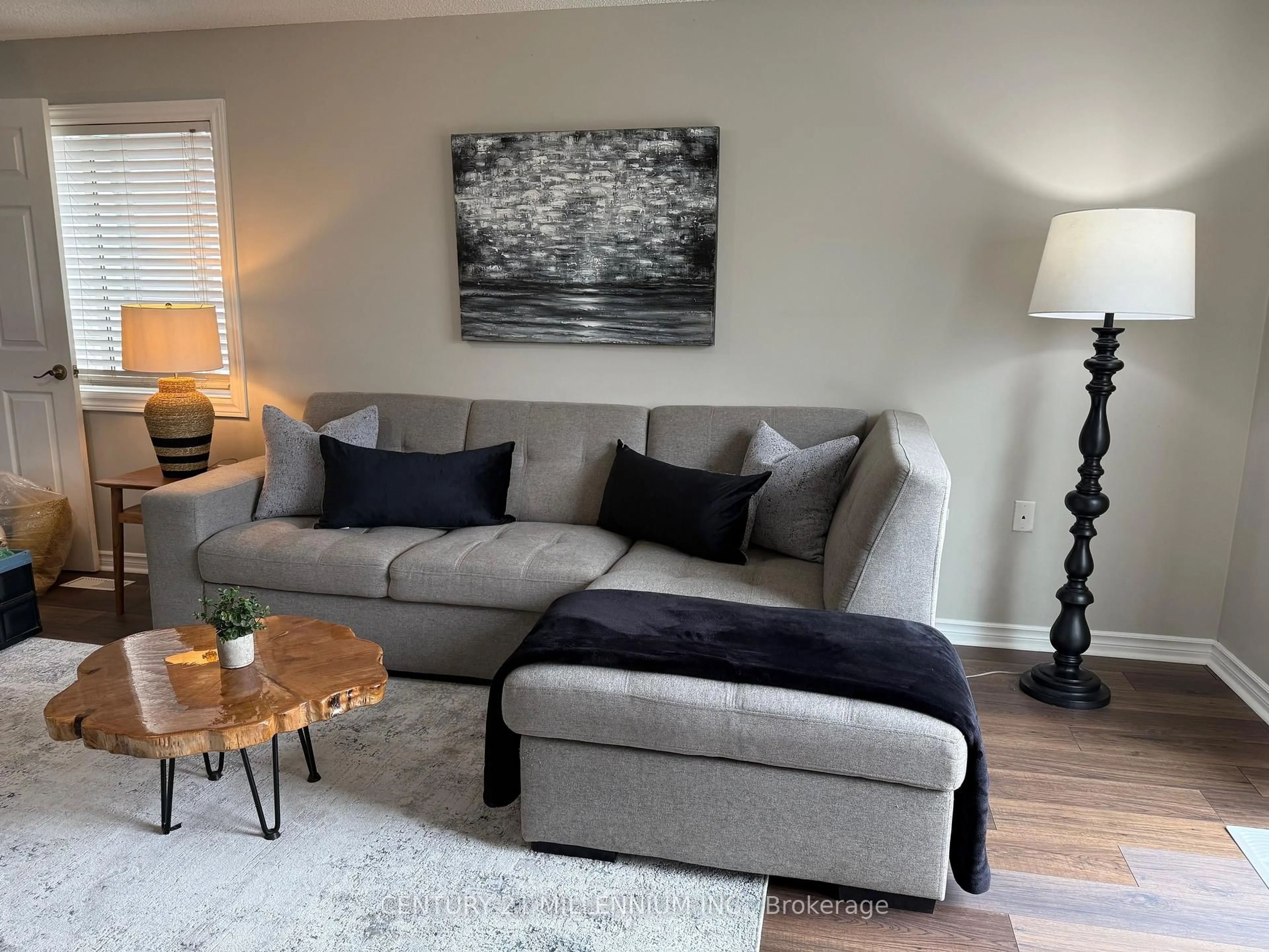 Living room with furniture, wood/laminate floor for 54 Arthur Ave, Barrie Ontario L4M 6H5