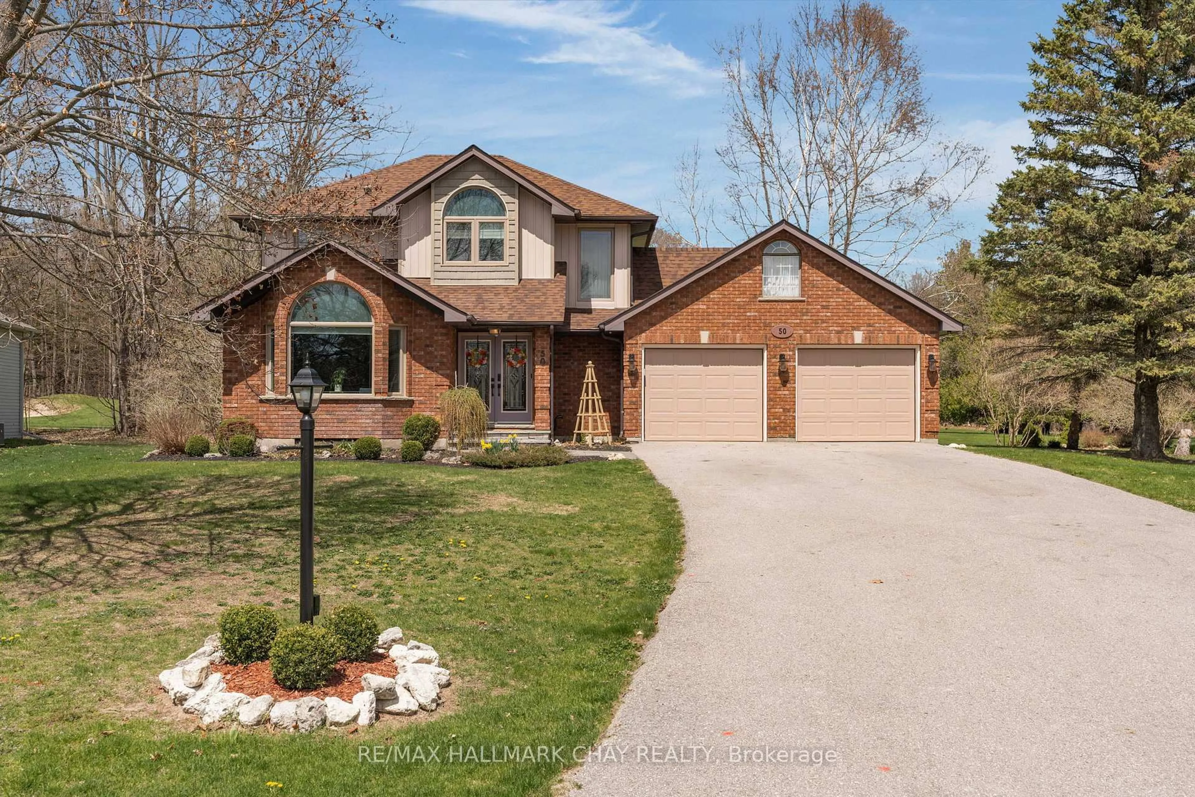 Home with brick exterior material, street for 50 Fairway Cres, Wasaga Beach Ontario L9Z 1B8