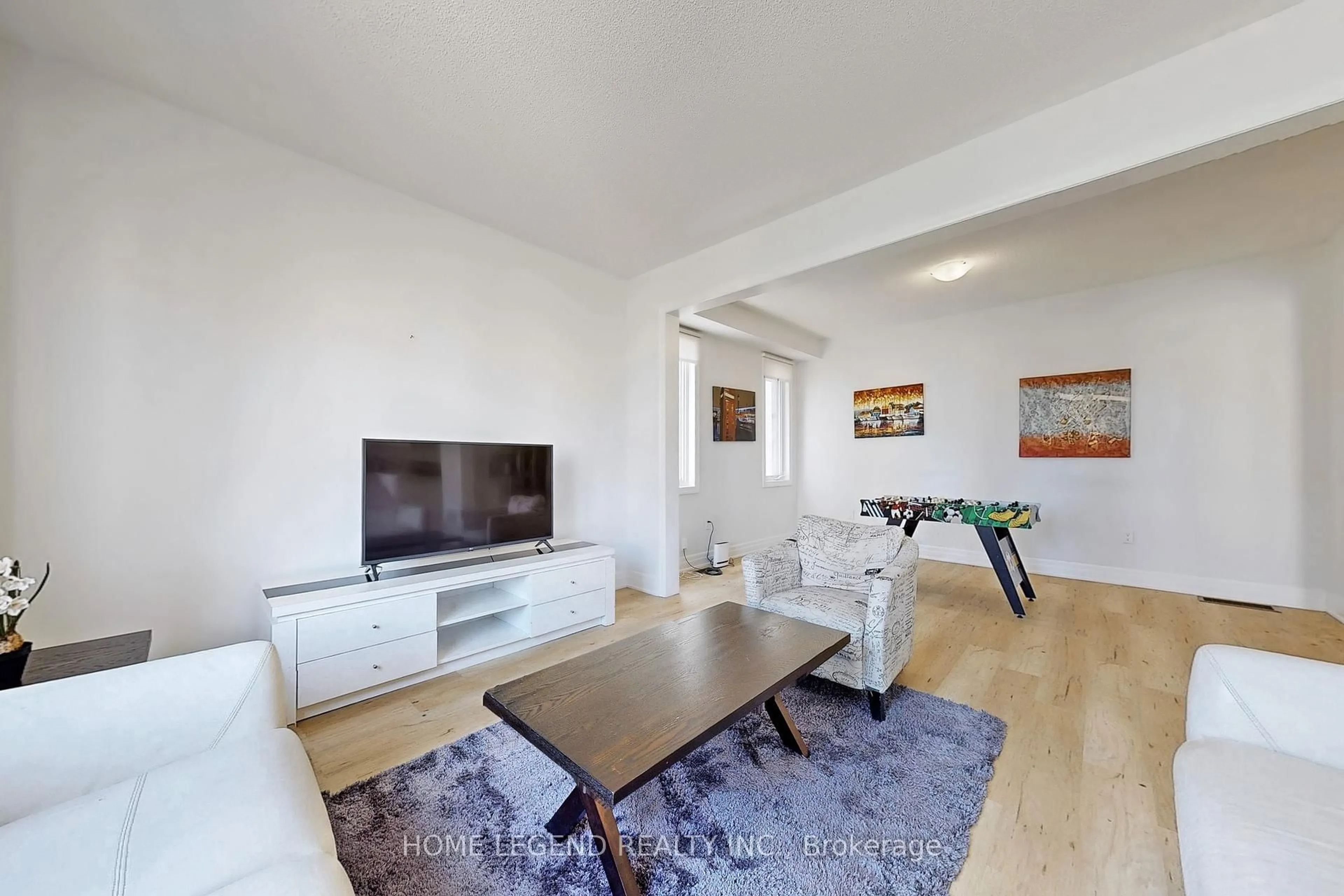 Living room with furniture, wood/laminate floor for 20 Nicort Rd, Wasaga Beach Ontario L9Z 0N4