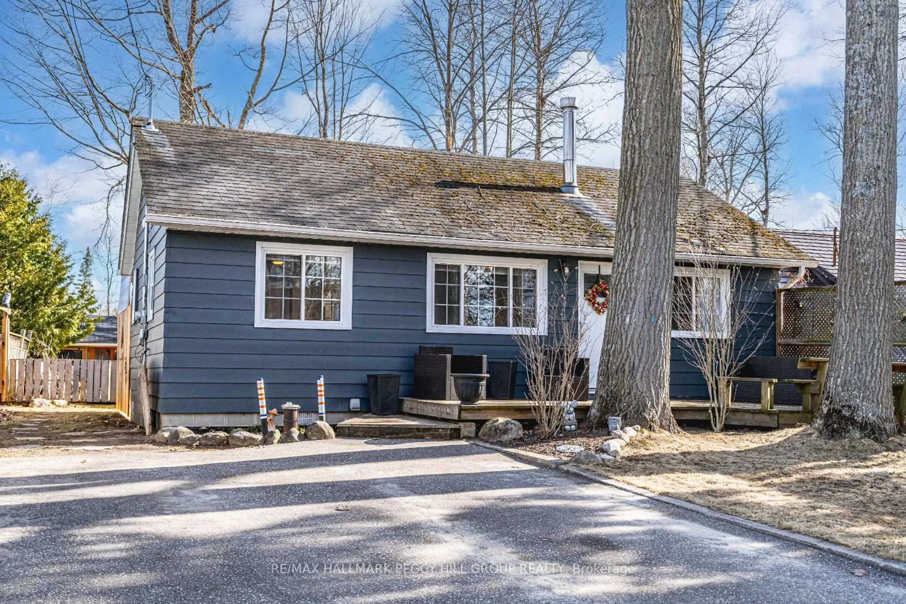 Home with vinyl exterior material, street for 1939 Tiny Beaches Rd, Tiny Ontario L0L 1P1