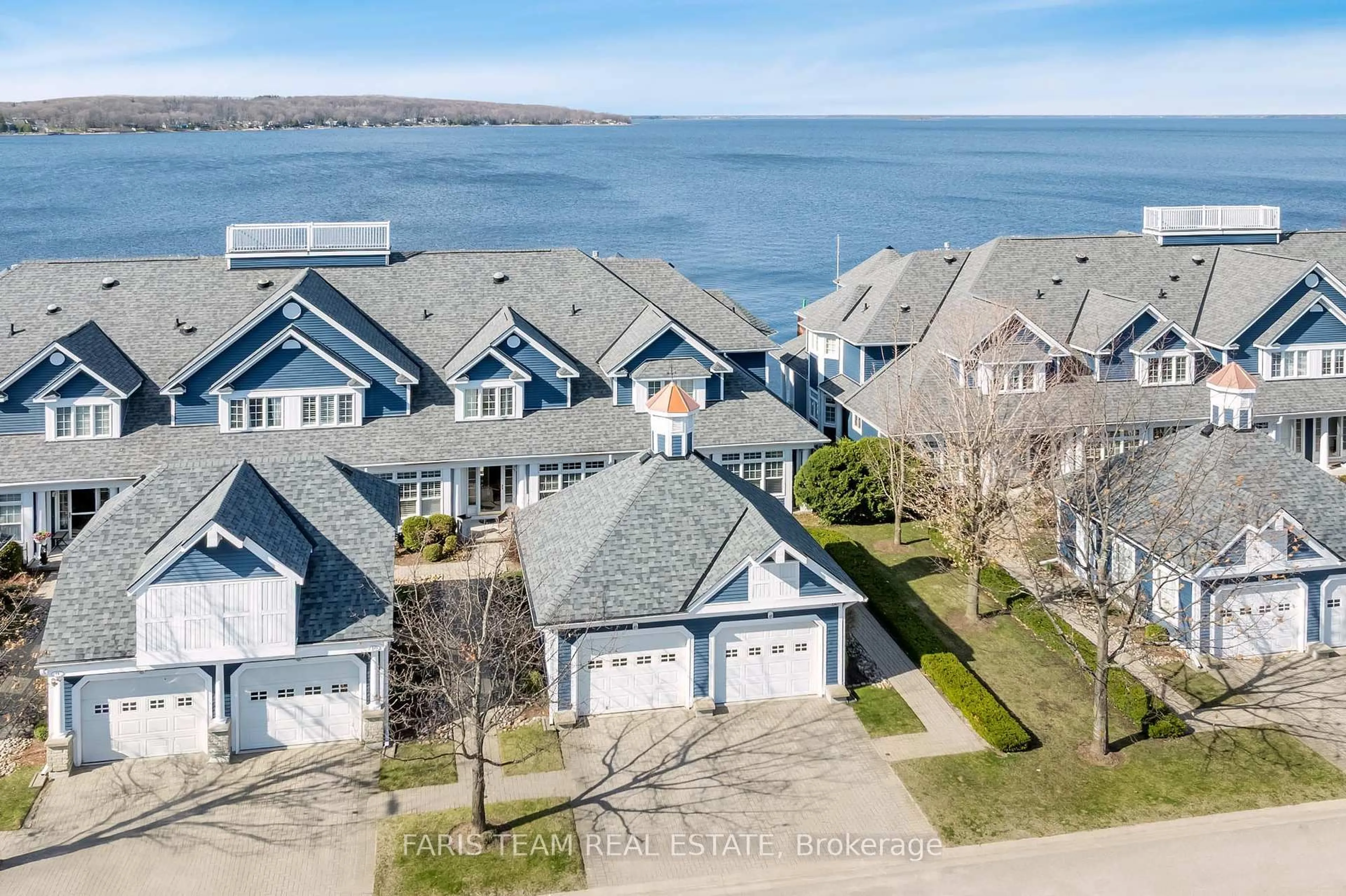 A pic from outside/outdoor area/front of a property/back of a property/a pic from drone, water/lake/river/ocean view for 155 William St #12, Midland Ontario L4R 5N1