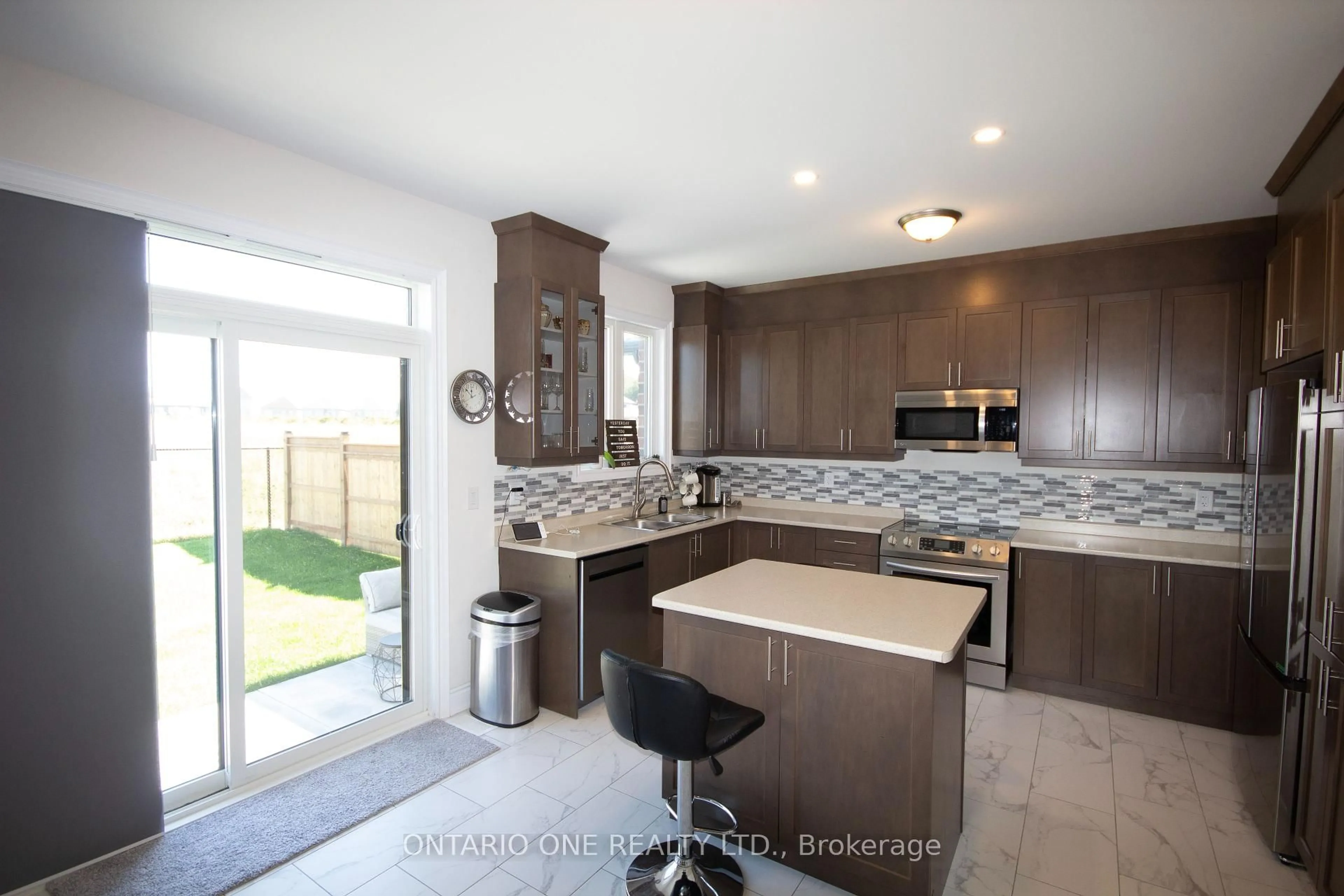 Open concept kitchen, ceramic/tile floor for 3129 Orion Blvd, Orillia Ontario L3V 8L8