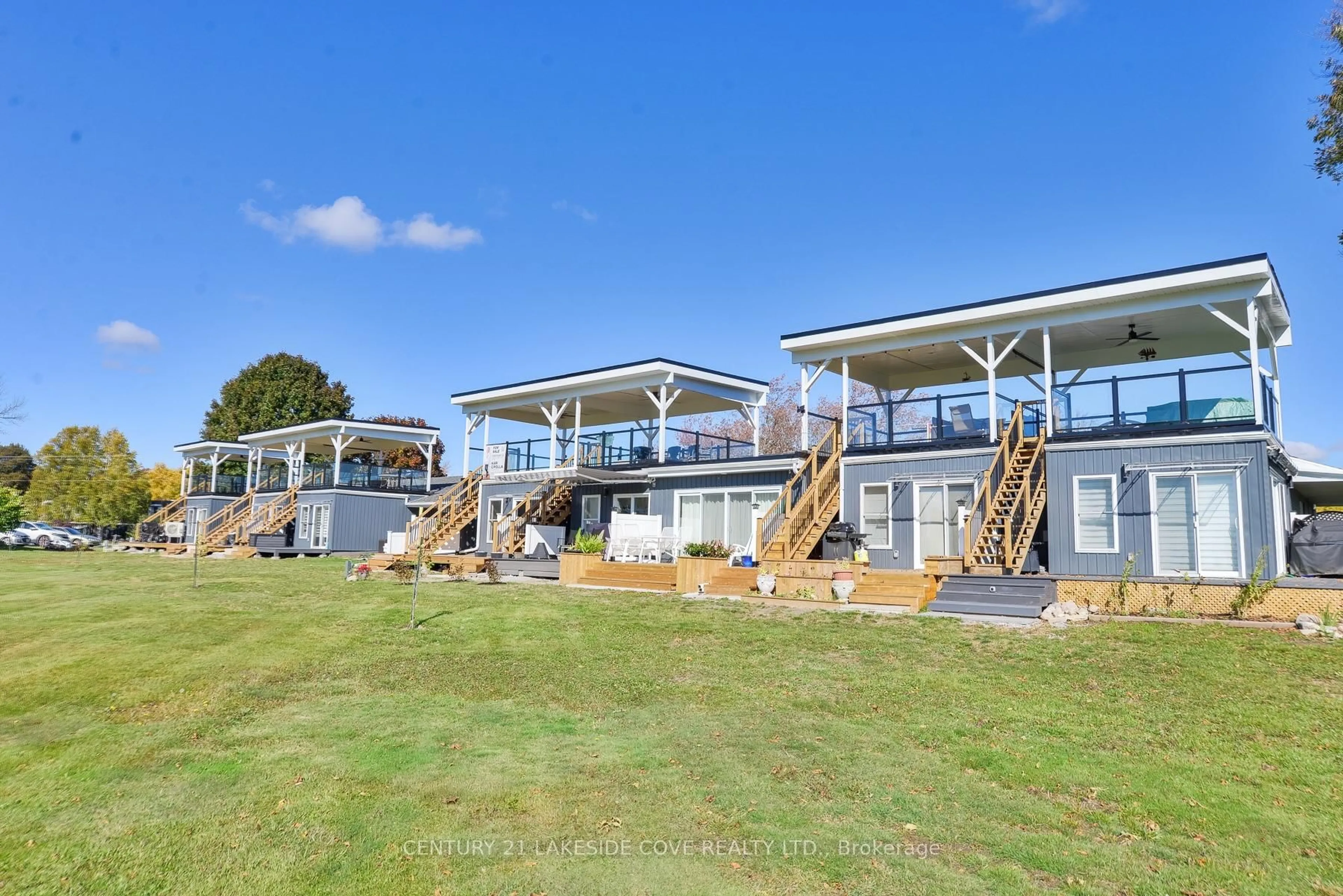 A pic from outside/outdoor area/front of a property/back of a property/a pic from drone, water/lake/river/ocean view for 3 Paradise Blvd #Unit 2, Ramara Ontario L0K 1B0