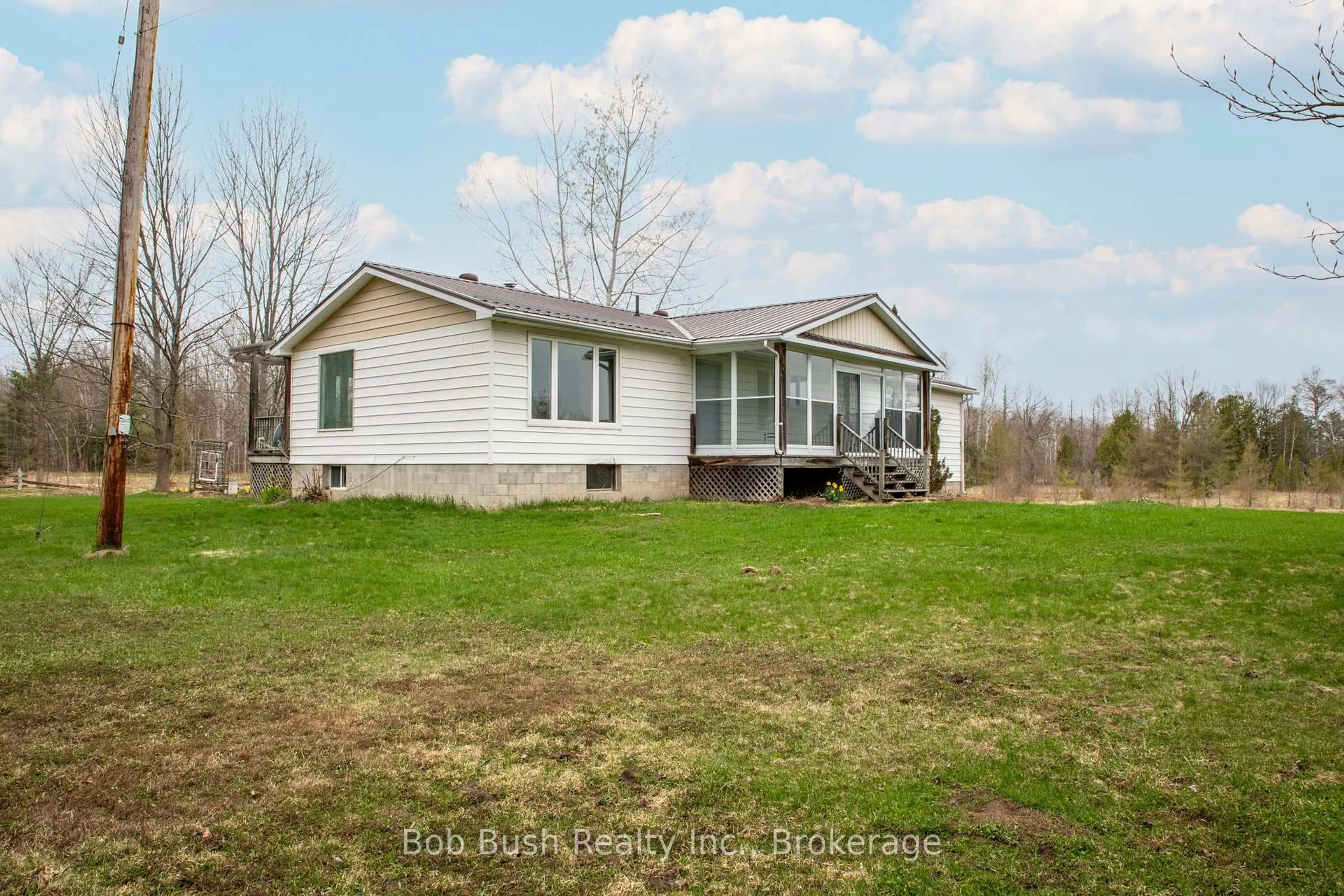 A pic from outside/outdoor area/front of a property/back of a property/a pic from drone, water/lake/river/ocean view for 10596 12 Highway, Oro-Medonte Ontario L0K 2G0