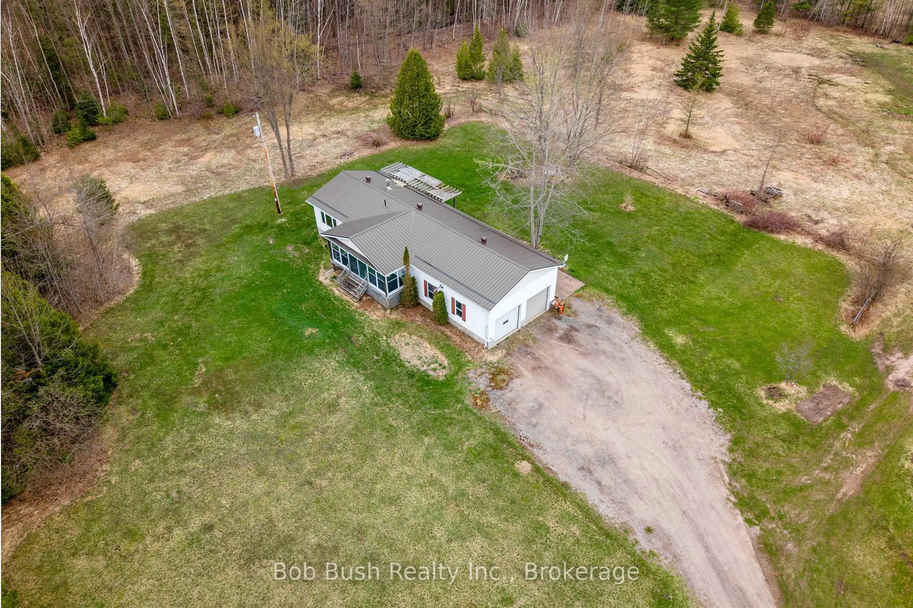 A pic from outside/outdoor area/front of a property/back of a property/a pic from drone, unknown for 10596 12 Highway, Oro-Medonte Ontario L0K 2G0