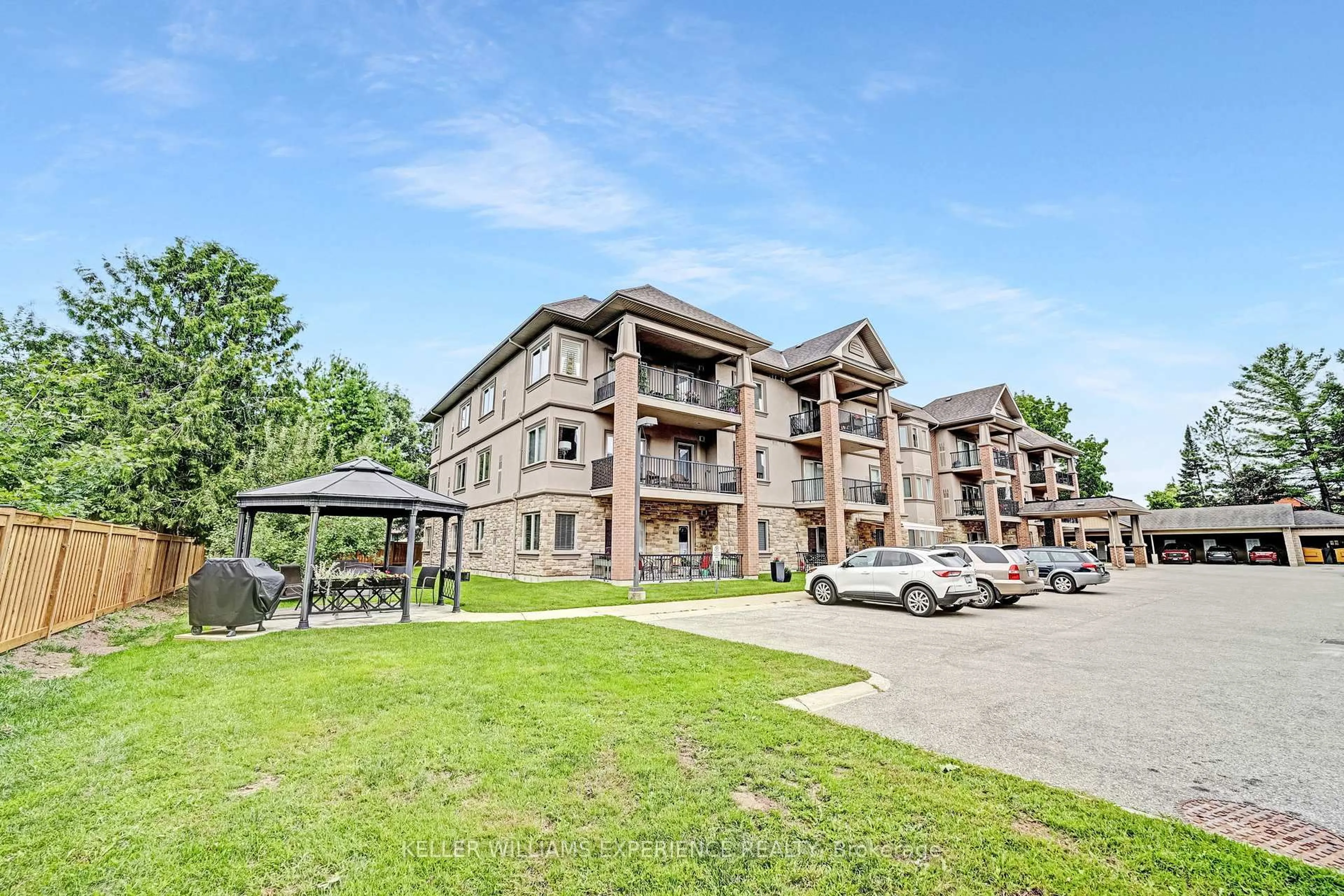 A pic from outside/outdoor area/front of a property/back of a property/a pic from drone, unknown for 19B Yonge St #103, Springwater Ontario L0L 1P0