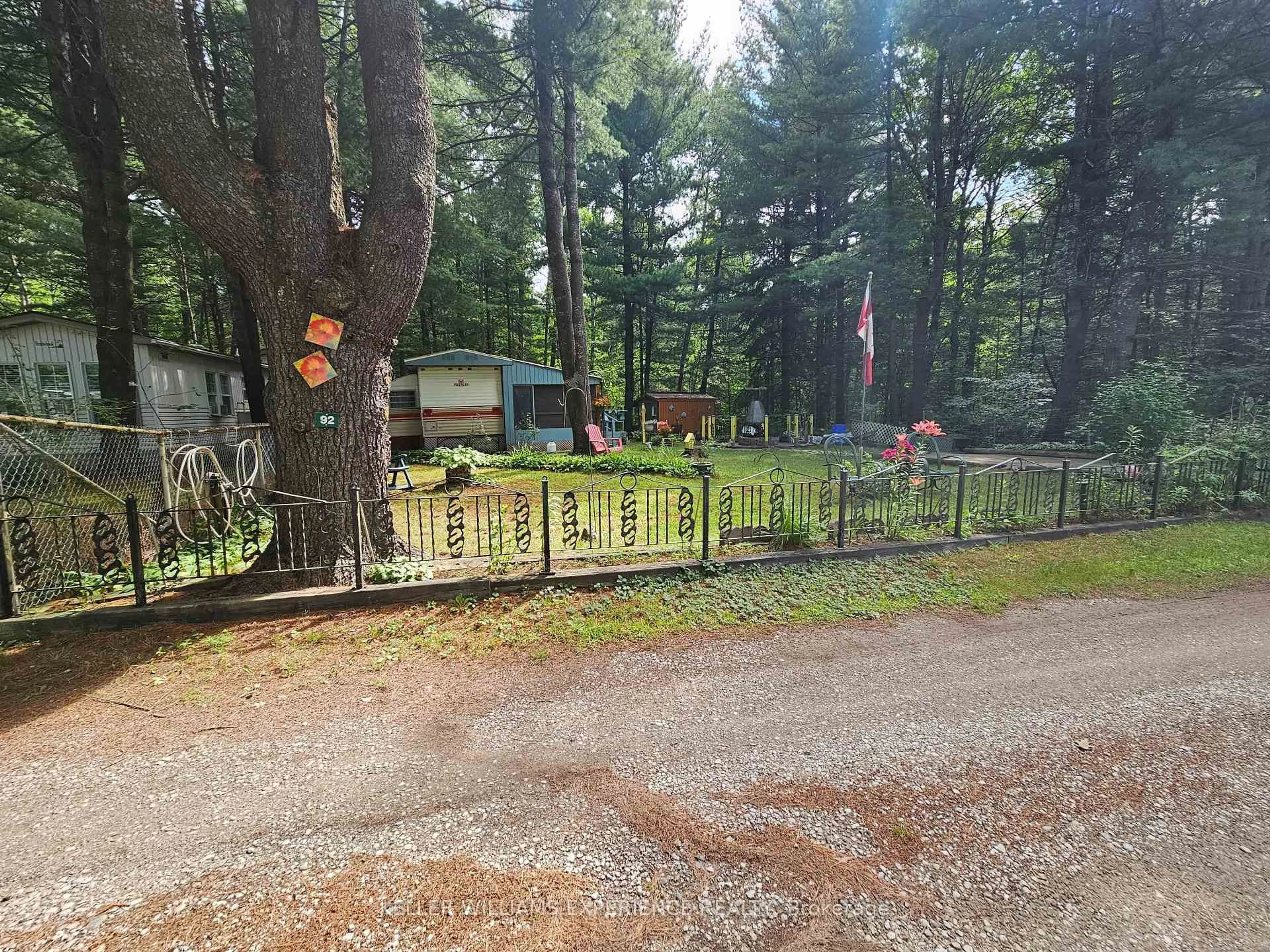 A pic from outside/outdoor area/front of a property/back of a property/a pic from drone, forest/trees view for 5216 County 90 Rd #92, Springwater Ontario L0M 1T0