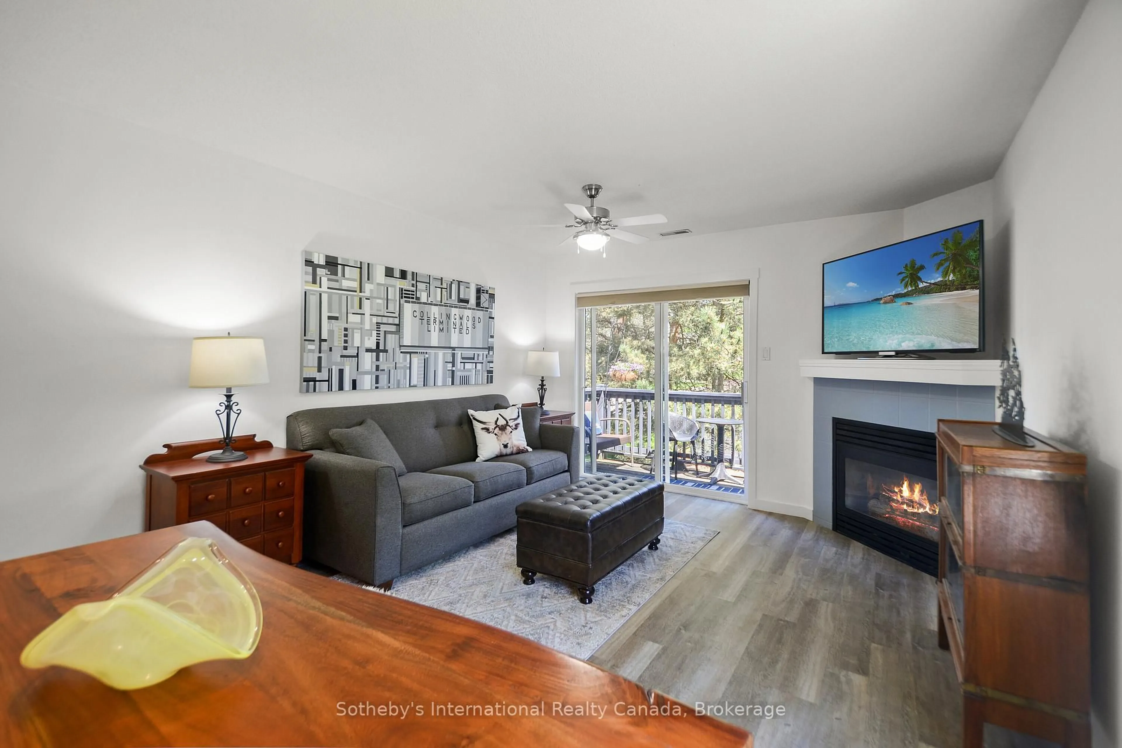 Living room with furniture, wood/laminate floor for 331 MARINERS Way, Collingwood Ontario L9Y 5C7