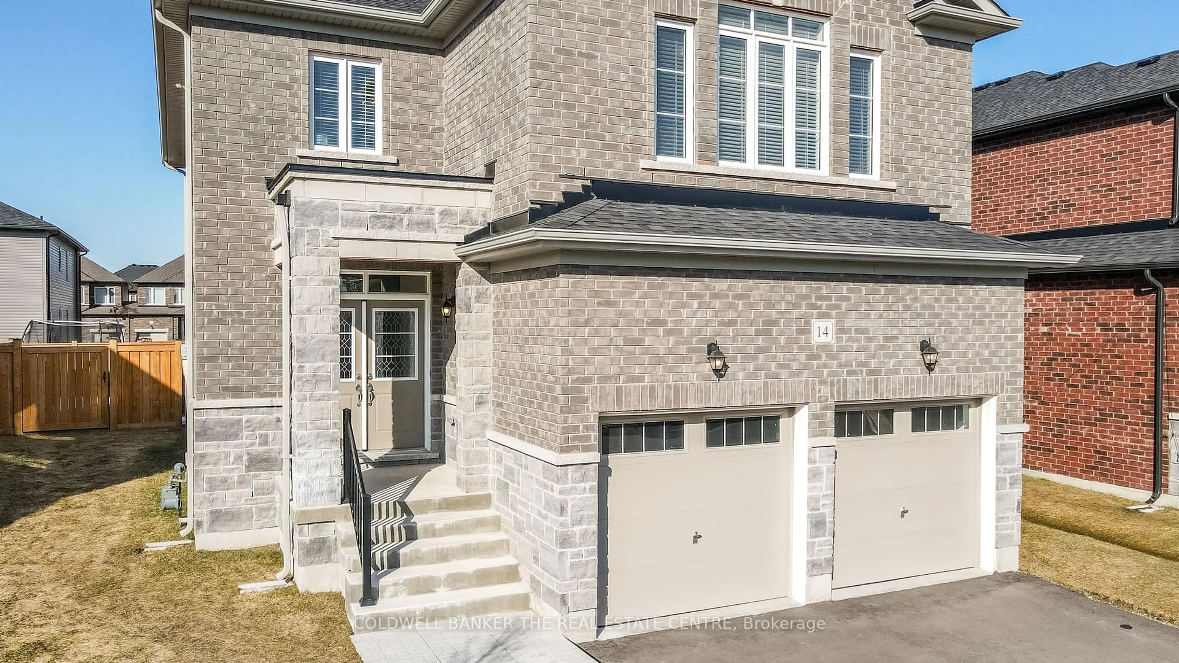 Home with brick exterior material, street for 14 Emerald St, Wasaga Beach Ontario L9Z 0K8