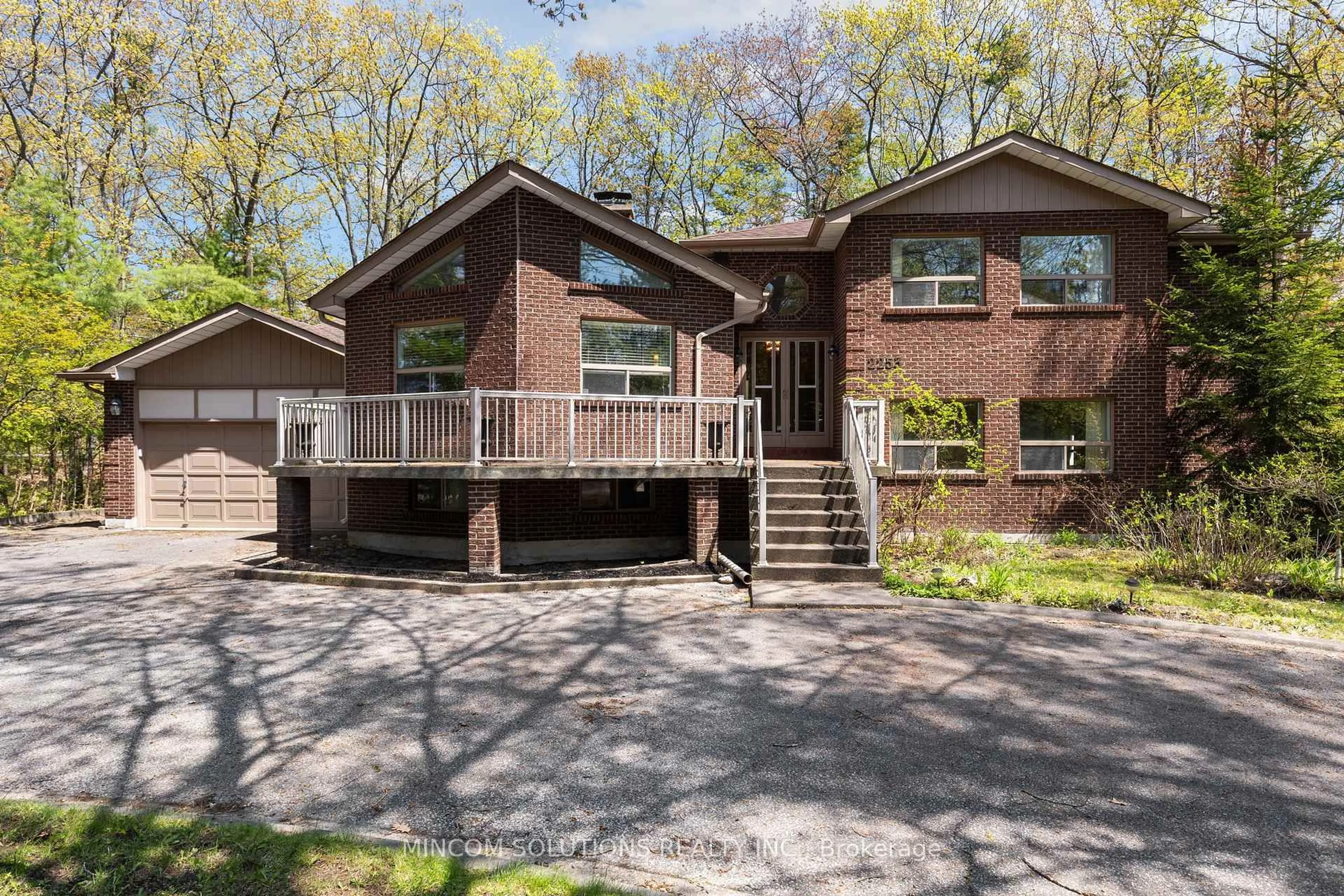 Home with brick exterior material, street for 2253 Tiny Beaches Rd, Tiny Ontario L0L 1P1