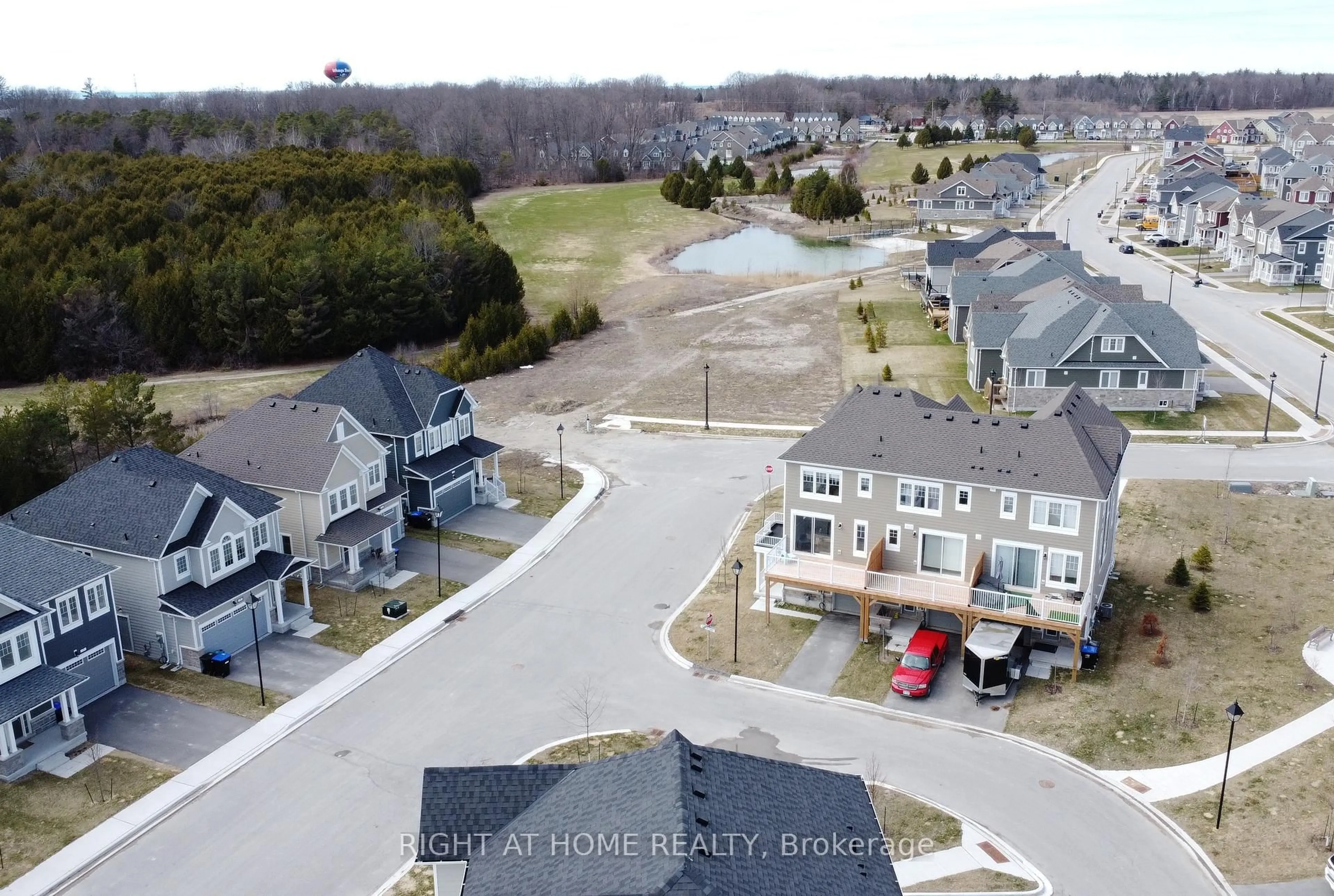 A pic from outside/outdoor area/front of a property/back of a property/a pic from drone, street for 8 Spencer Blvd, Wasaga Beach Ontario L9Z 0K1